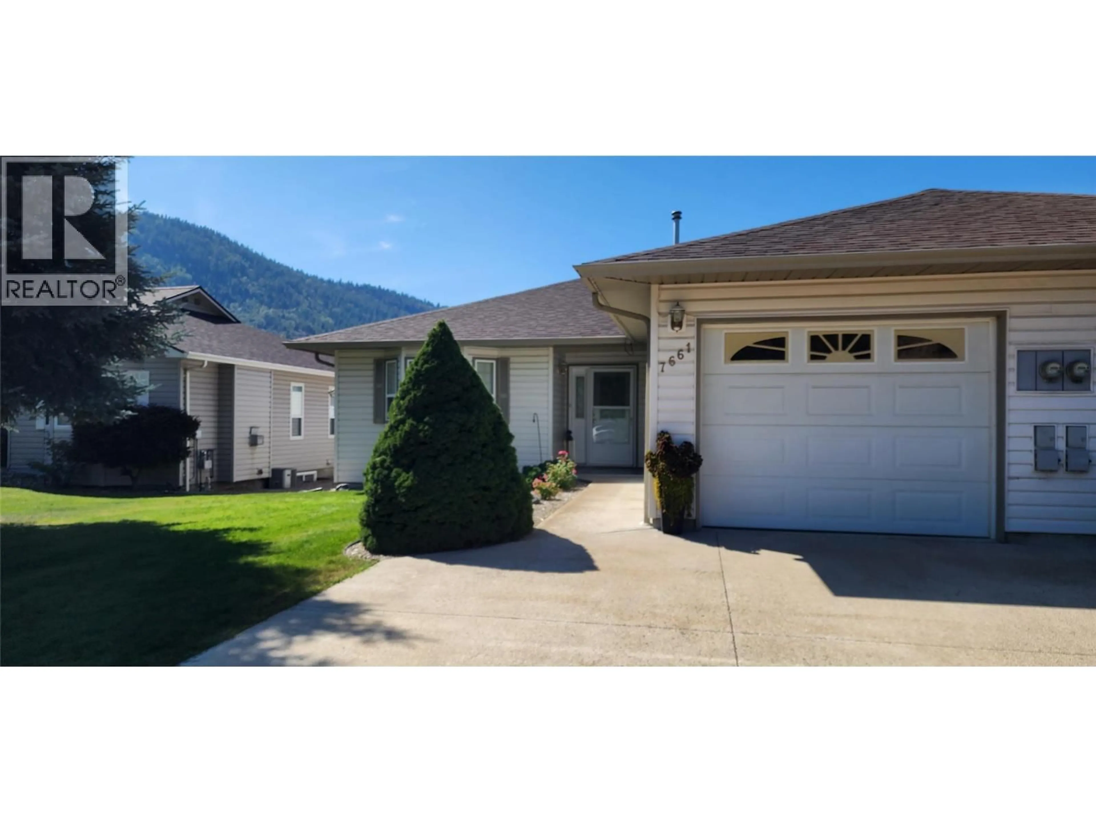 Home with vinyl exterior material, mountain view for 7661 CREMA DRIVE, Trail British Columbia V1R2Y8