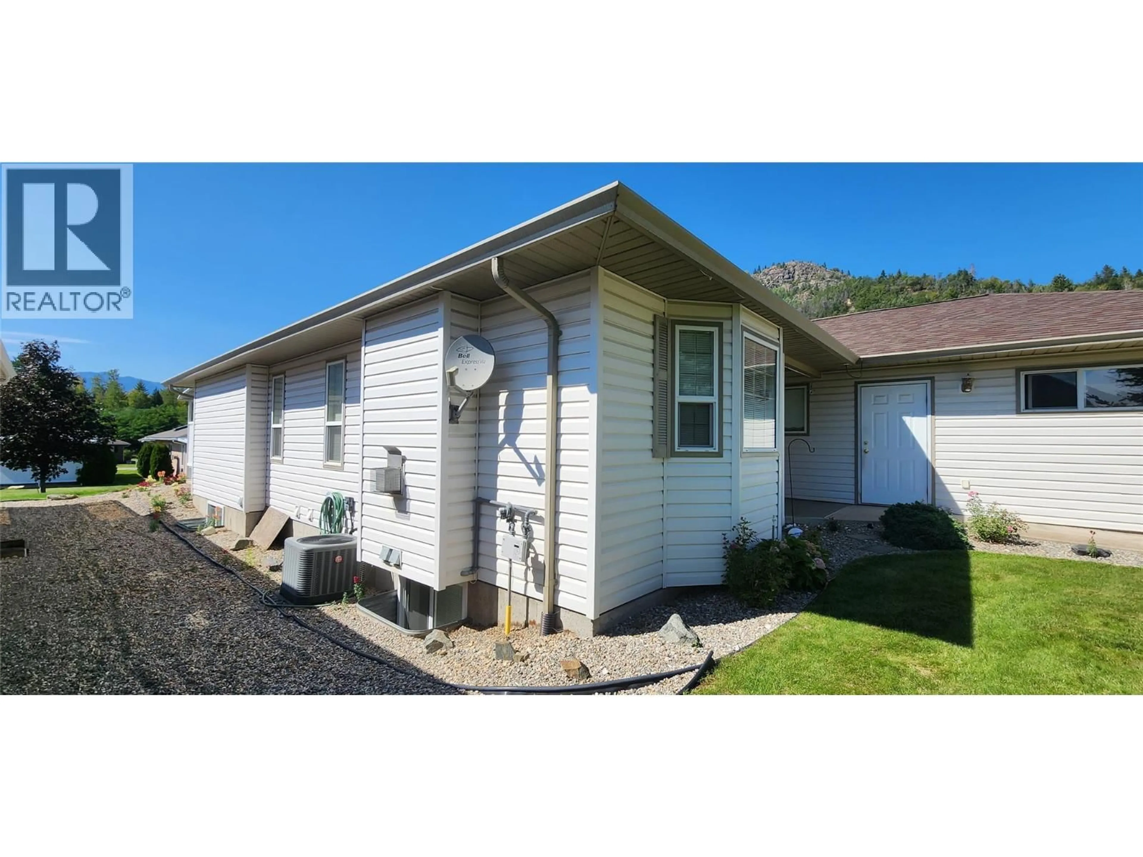 Home with vinyl exterior material, street for 7661 CREMA DRIVE, Trail British Columbia V1R2Y8