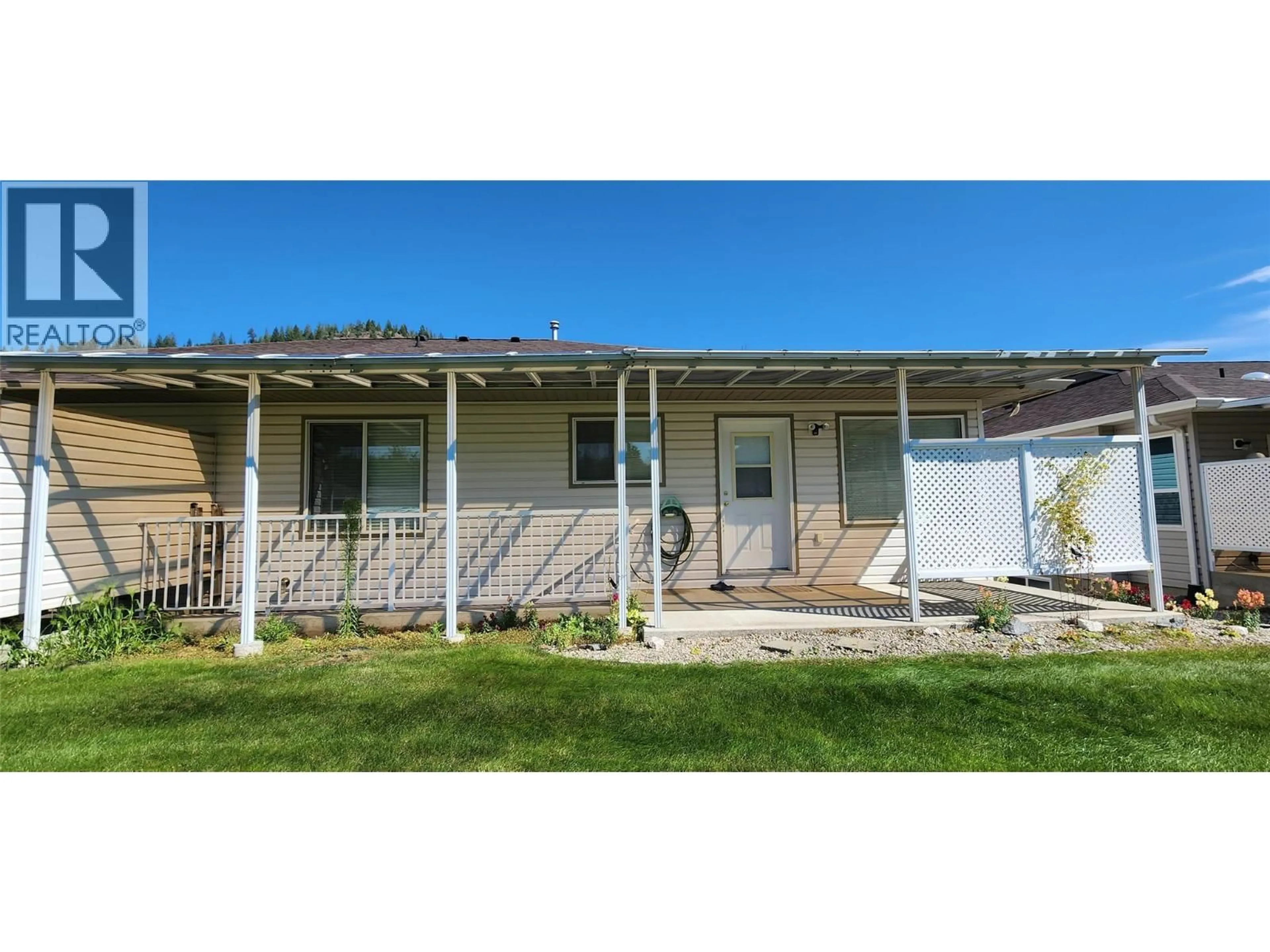 Home with vinyl exterior material, street for 7661 CREMA DRIVE, Trail British Columbia V1R2Y8