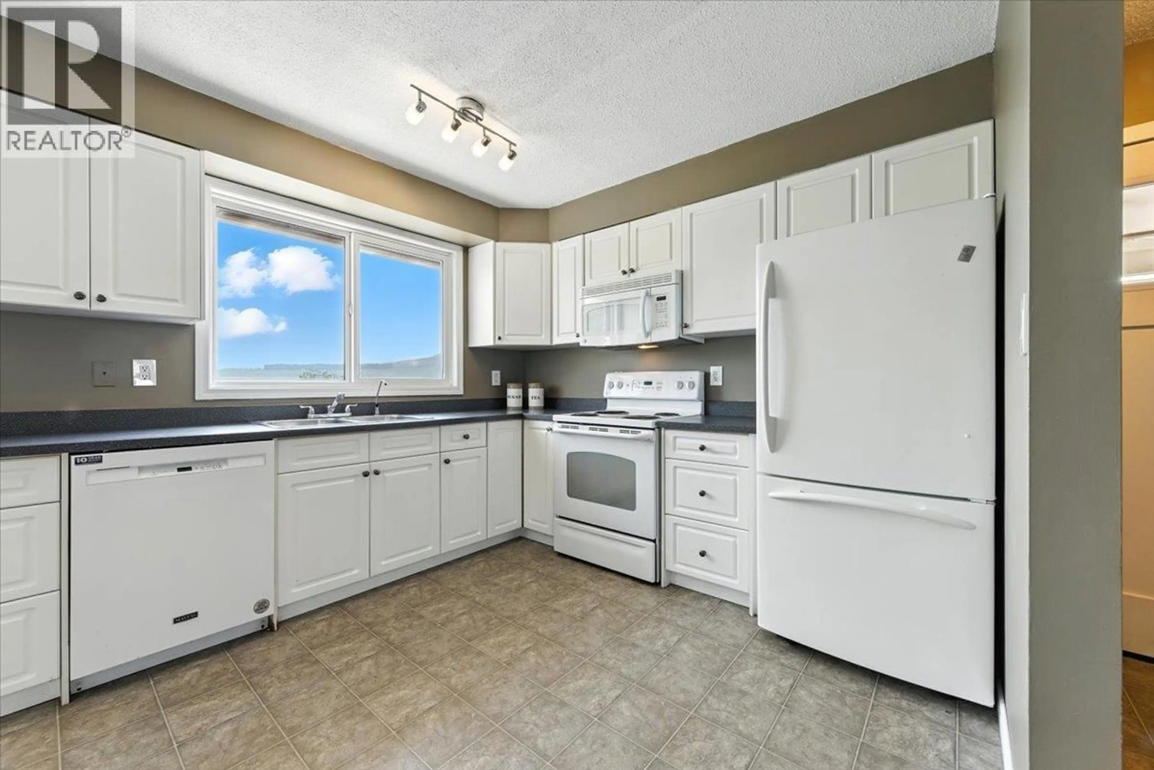 Standard kitchen, ceramic/tile floor for 6721 GARNET ROAD, Vernon British Columbia V1H1P1
