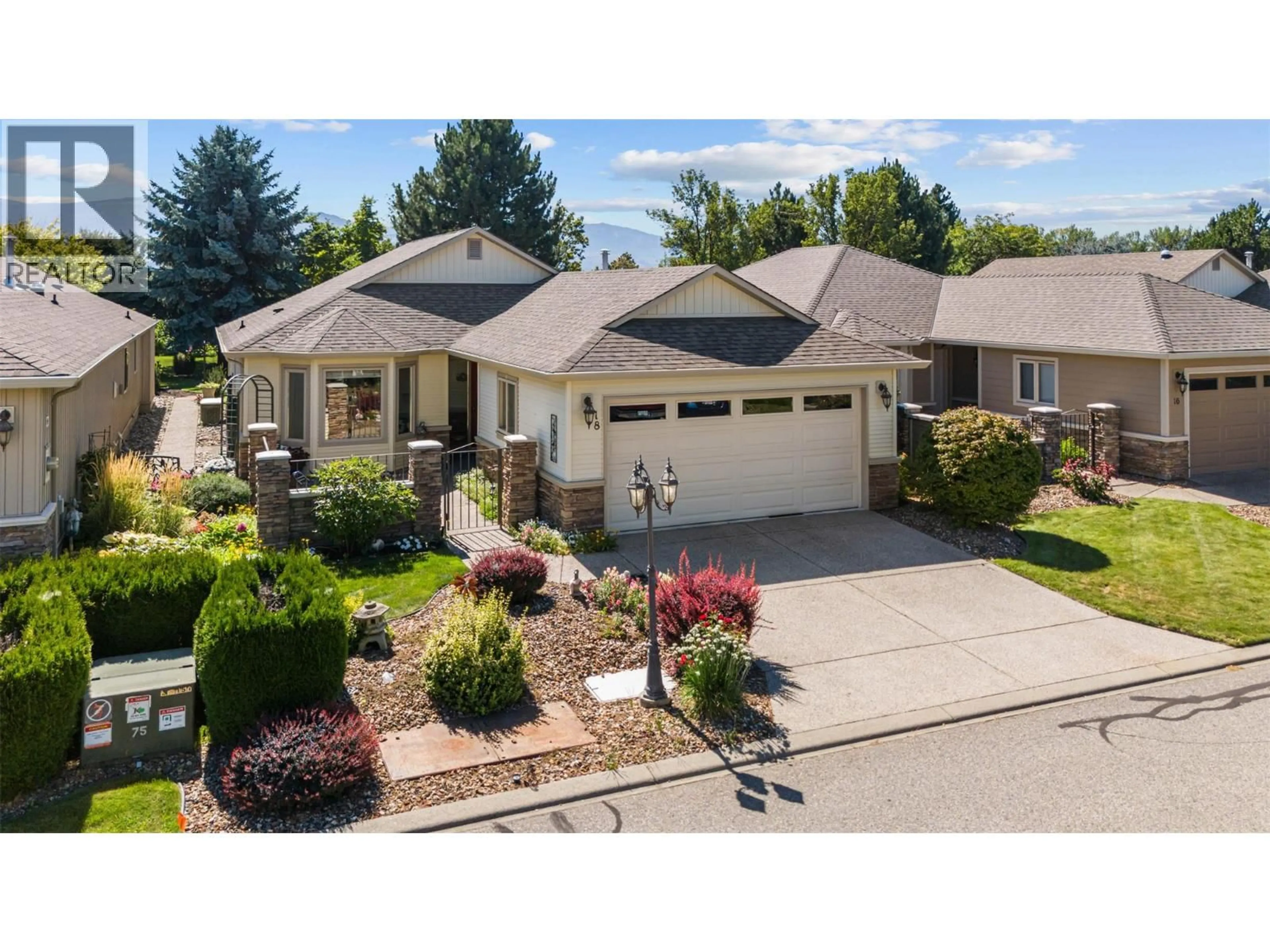 A pic from outside/outdoor area/front of a property/back of a property/a pic from drone, street for 18 - 2365 STILLINGFLEET ROAD, Kelowna British Columbia V1W4X5