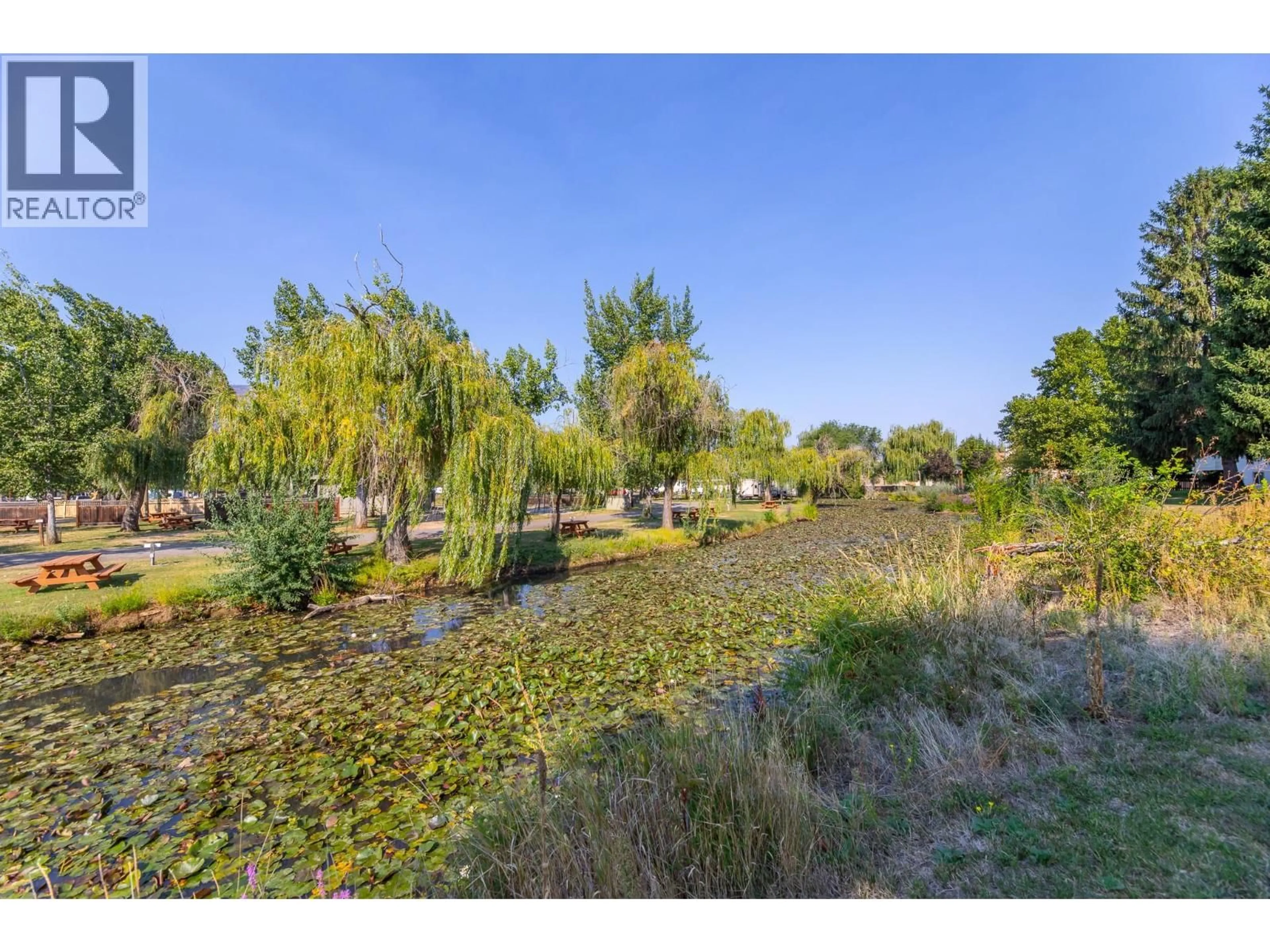 A pic from outside/outdoor area/front of a property/back of a property/a pic from drone, water/lake/river/ocean view for 313 - 150 SKAHA PLACE, Penticton British Columbia V2A7K1