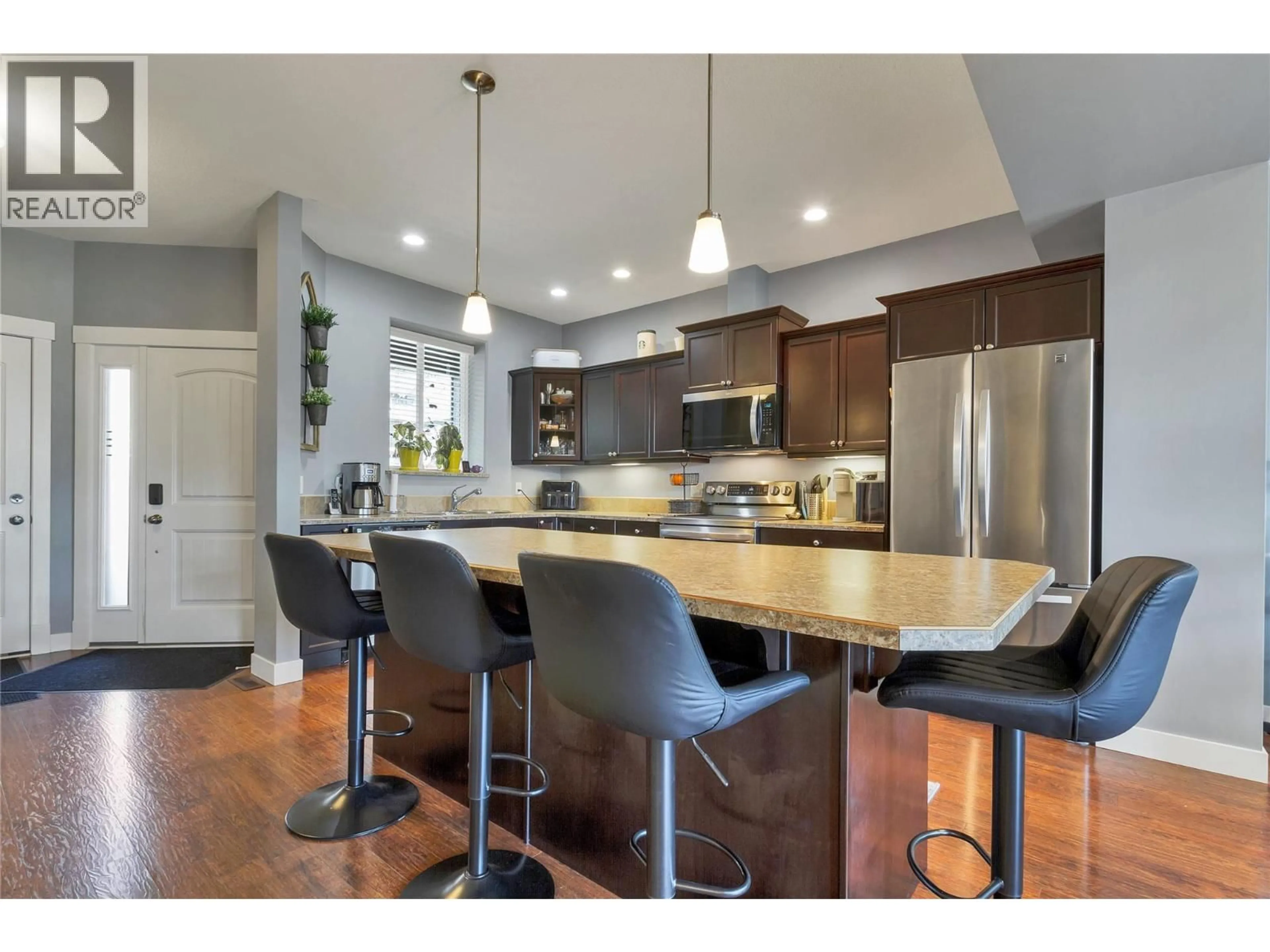 Open concept kitchen, wood/laminate floor for 245 - 3780 SCHUBERT ROAD, Armstrong British Columbia V4Y0Y1
