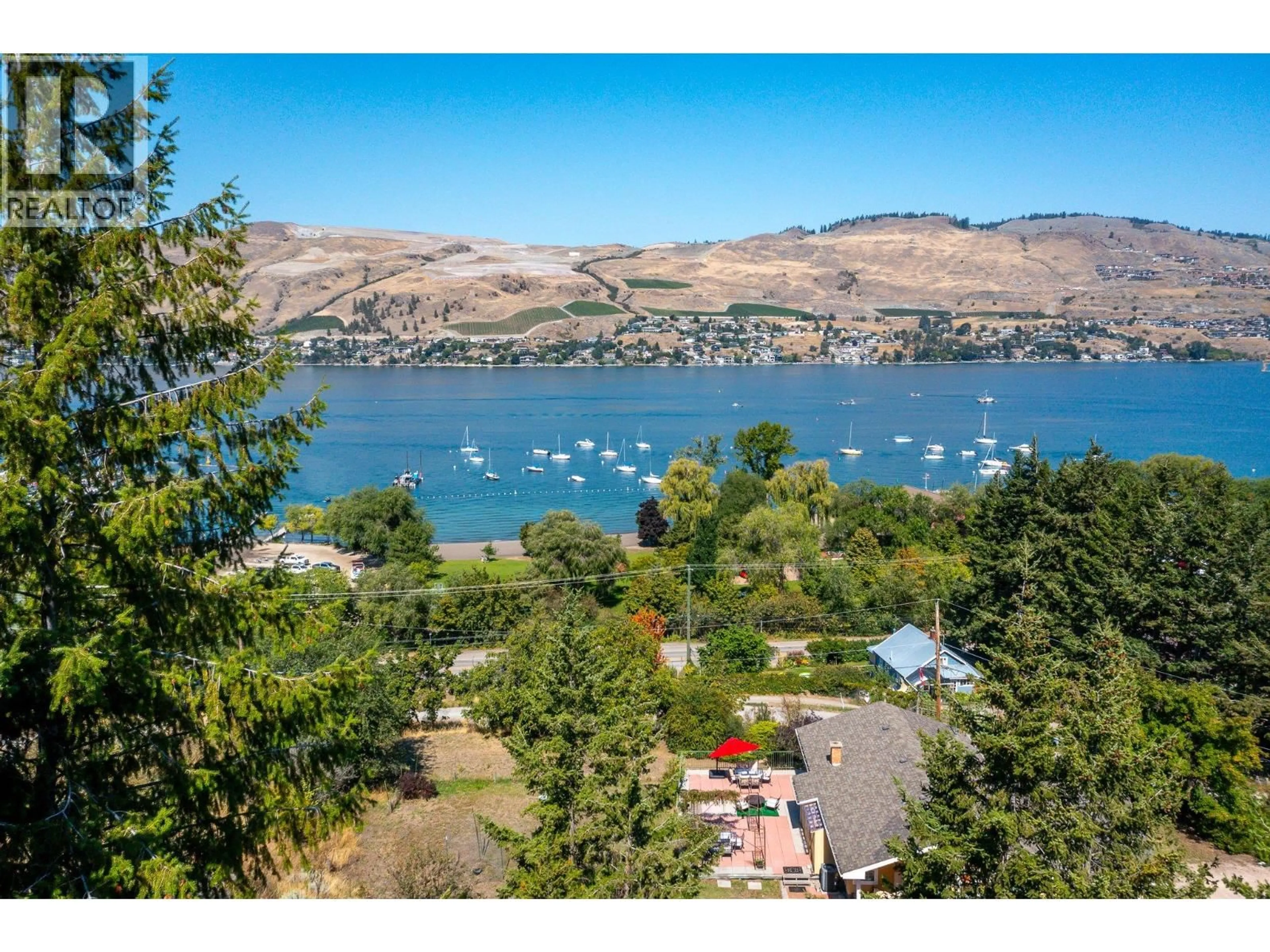 A pic from outside/outdoor area/front of a property/back of a property/a pic from drone, water/lake/river/ocean view for 7848 OKANAGAN LANDING BENCH ROAD, Vernon British Columbia V1H1H3