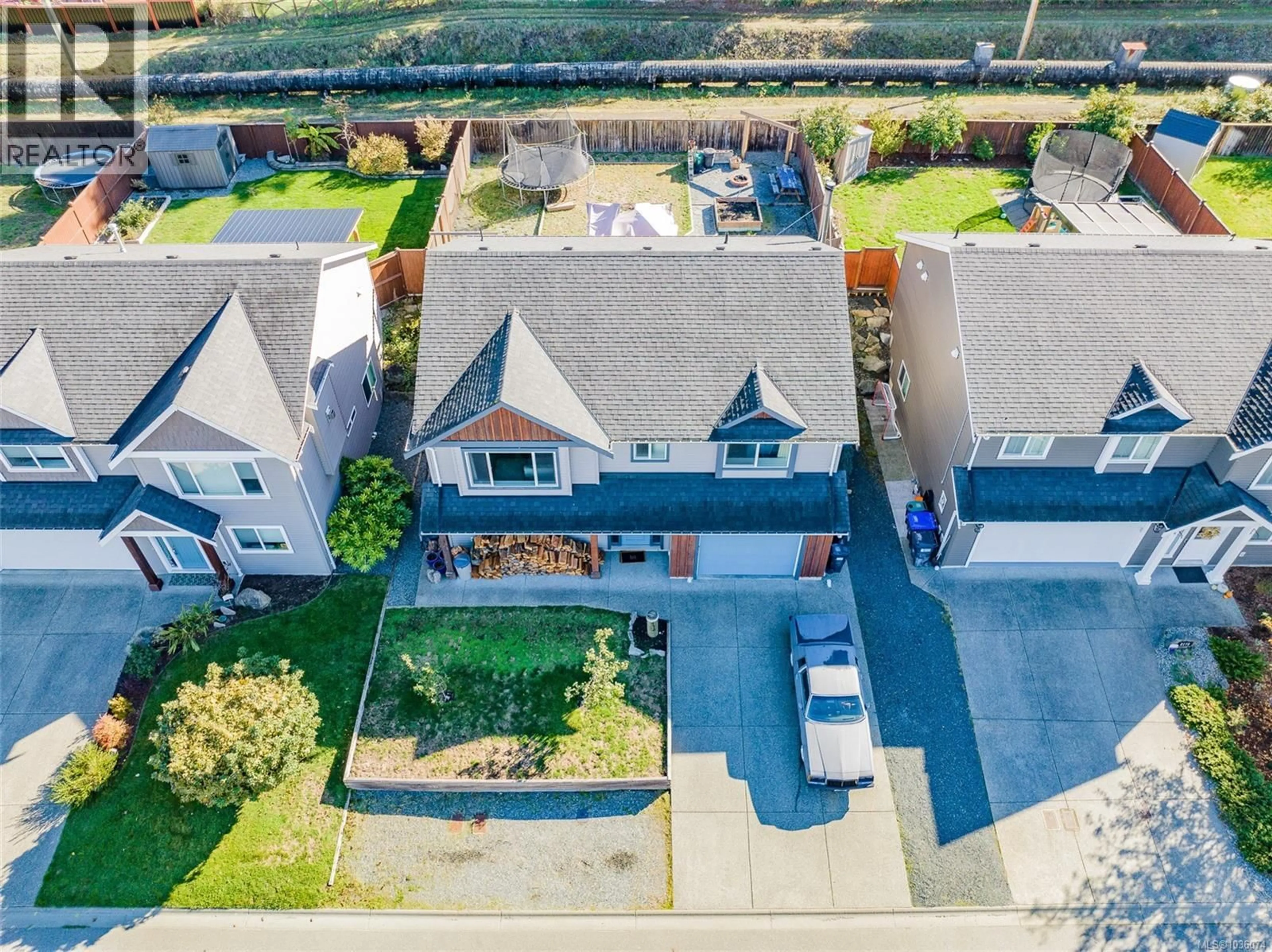 A pic from outside/outdoor area/front of a property/back of a property/a pic from drone, street for 2174 VILLAGE DRIVE, Nanaimo British Columbia V9X0A7