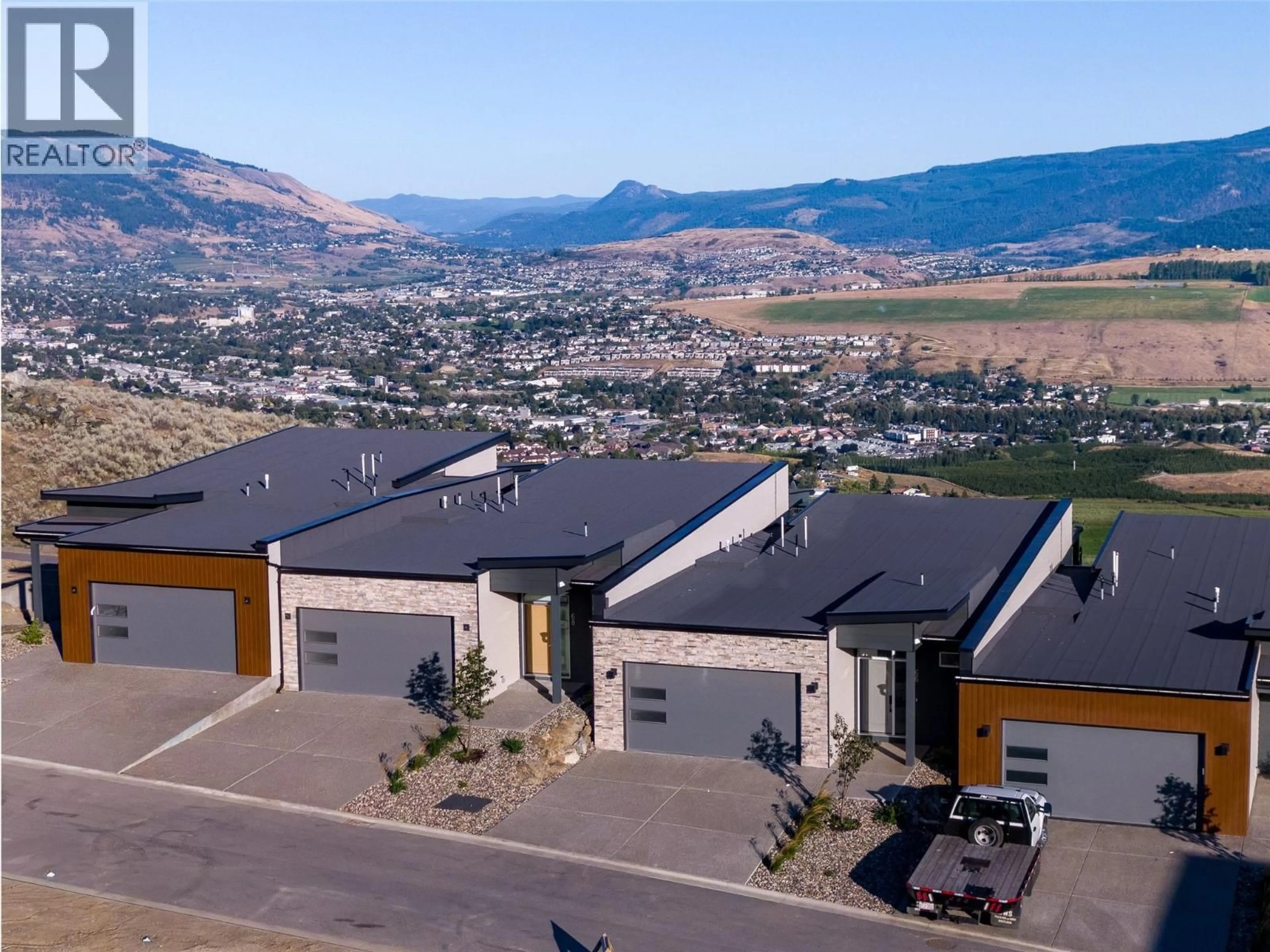 A pic from outside/outdoor area/front of a property/back of a property/a pic from drone, mountain view for 66 - 7735 OKANAGAN HILLS BOULEVARD, Vernon British Columbia V1H0A7