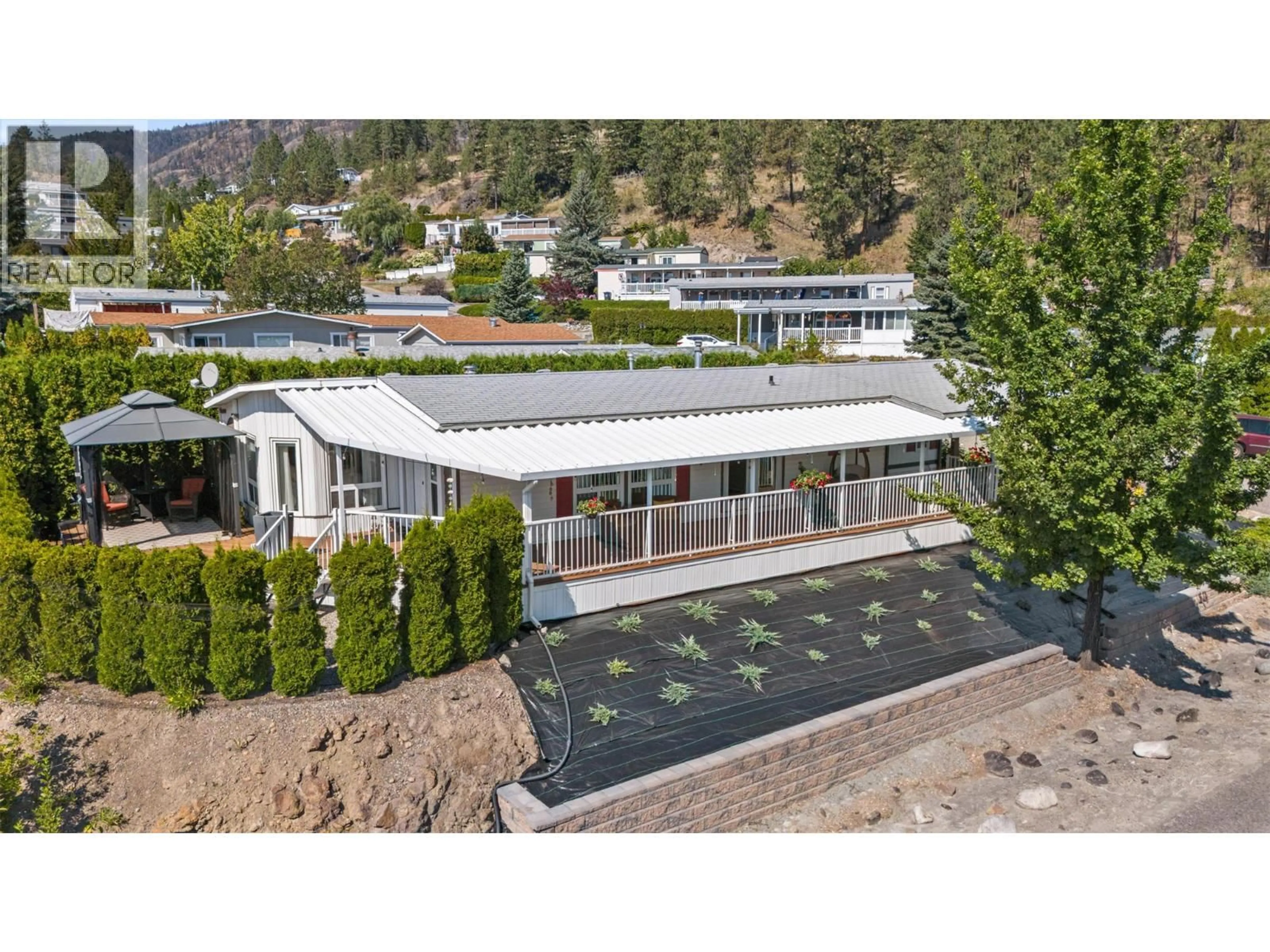 A pic from outside/outdoor area/front of a property/back of a property/a pic from drone, mountain view for 35 - 1750 LENZ ROAD, West Kelowna British Columbia V1Z3N1