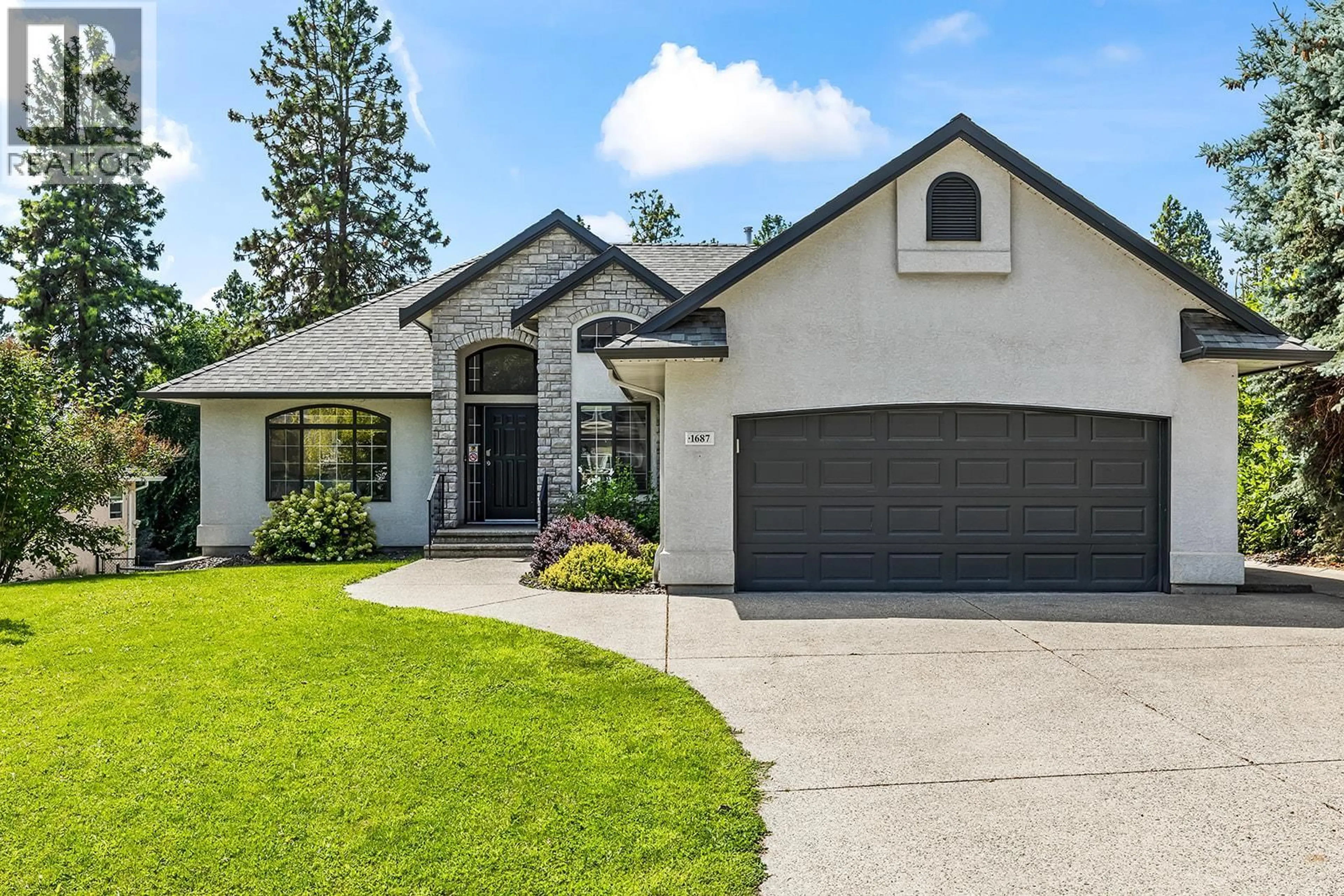 Home with vinyl exterior material, street for 1687 SPRUCEGLEN DRIVE, Kelowna British Columbia V1V2K8