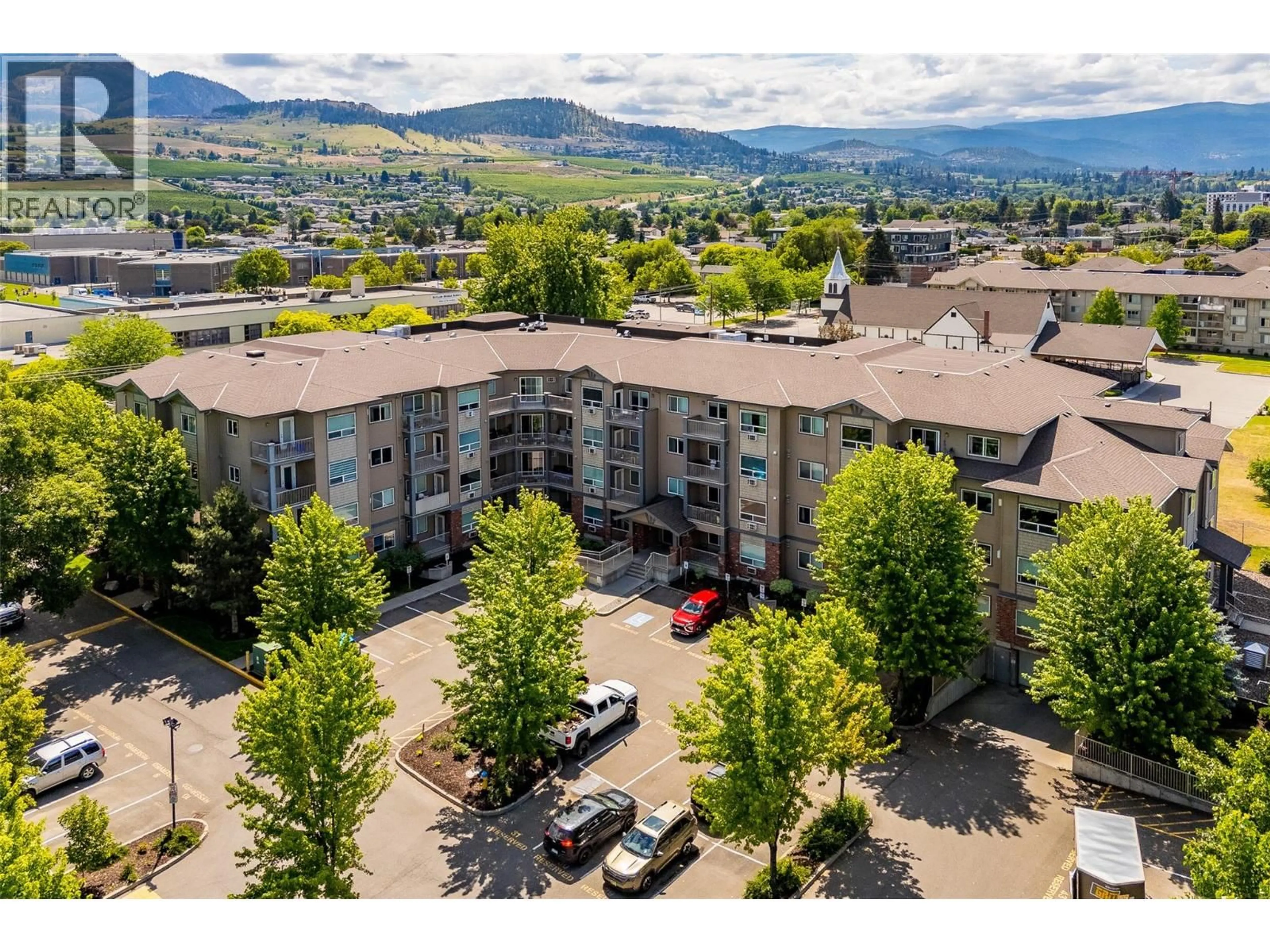 A pic from outside/outdoor area/front of a property/back of a property/a pic from drone, mountain view for 311 - 770 RUTLAND ROAD, Kelowna British Columbia V1X3B7