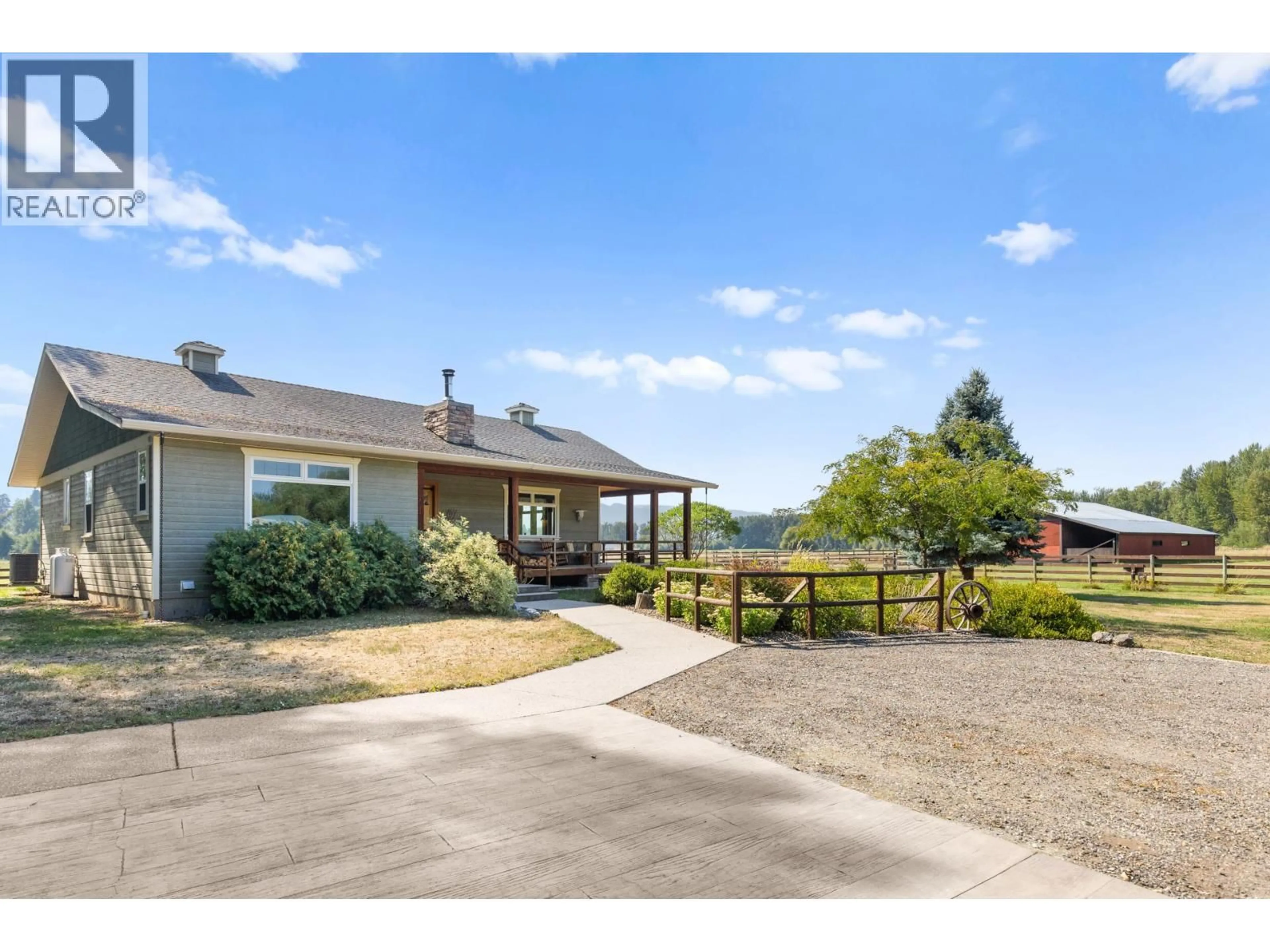 A pic from outside/outdoor area/front of a property/back of a property/a pic from drone, mountain view for 1795 HEIMLICH ROAD, Kelowna British Columbia V1W4A8
