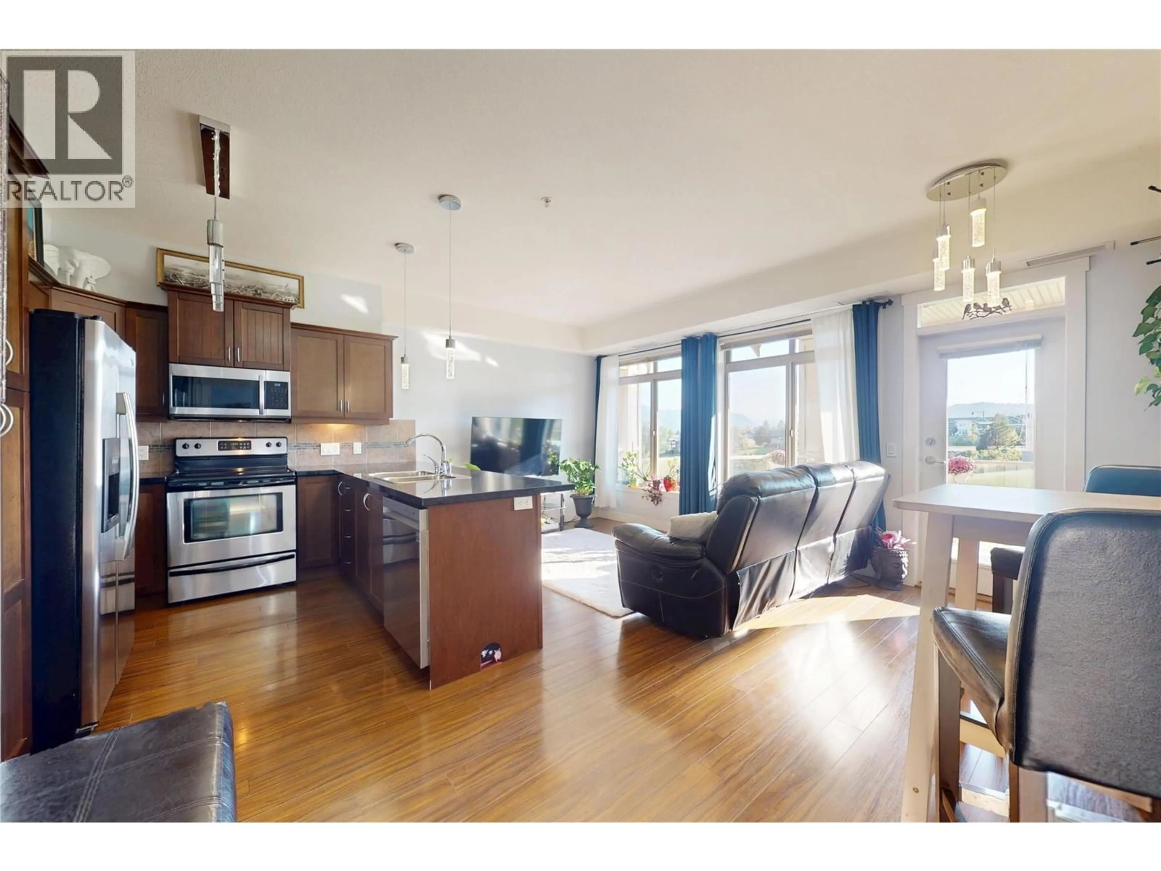 Open concept kitchen, wood/laminate floor for 207 - 3533 CARRINGTON ROAD, West Kelowna British Columbia V4T2E6