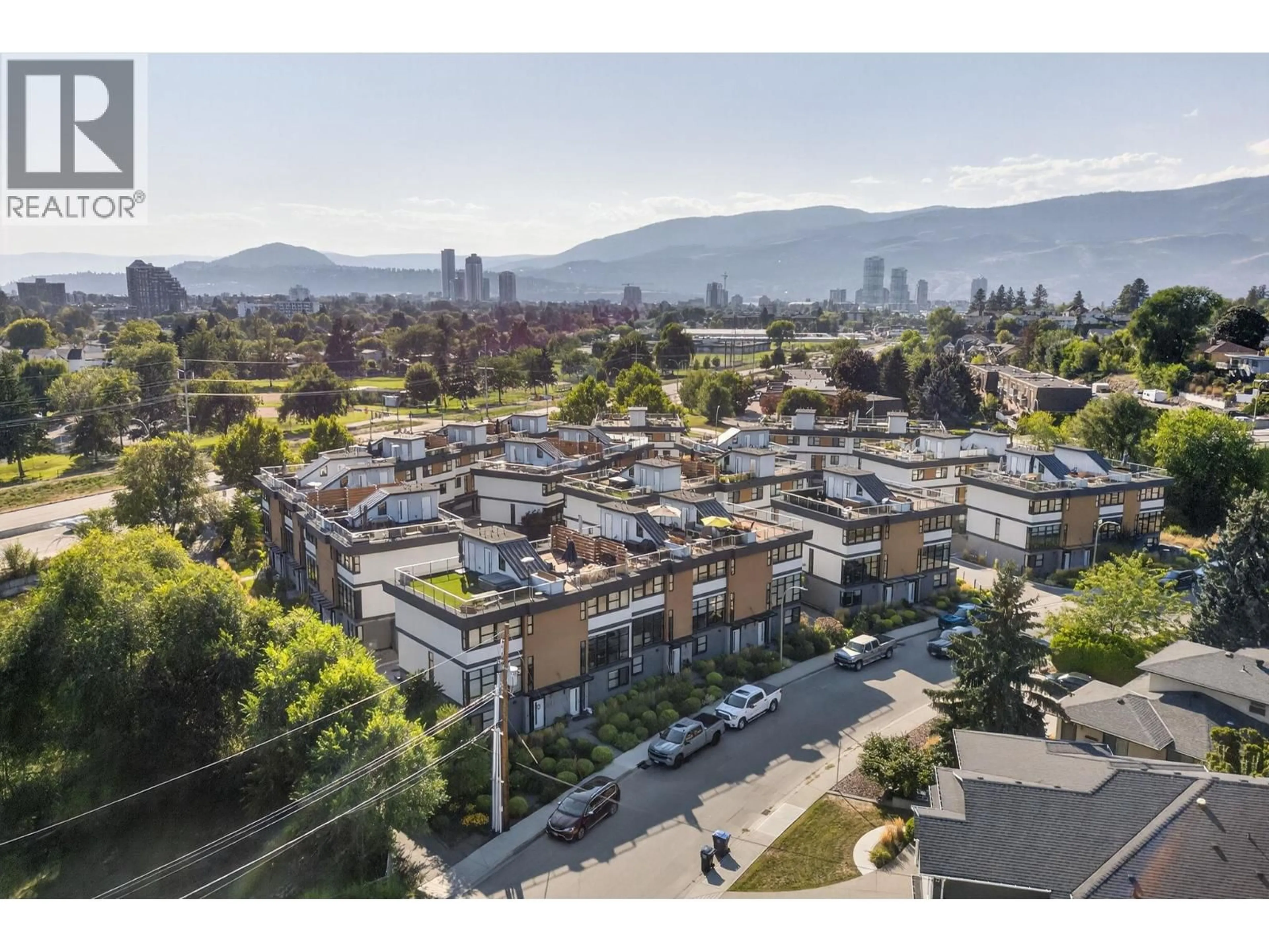 A pic from outside/outdoor area/front of a property/back of a property/a pic from drone, mountain view for 33 - 1515 HIGHLAND DRIVE, Kelowna British Columbia V1Y0C9