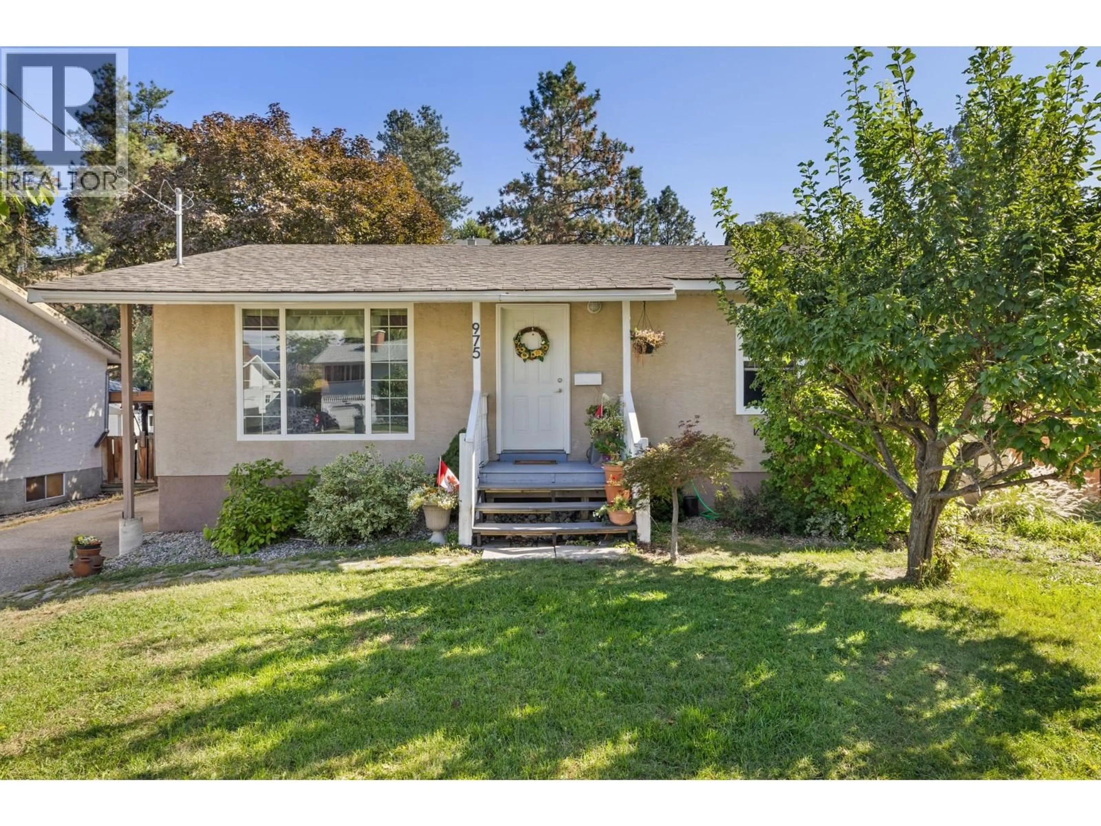 Home with vinyl exterior material, street for 975 NEPTUNE ROAD, Kelowna British Columbia V1X3E4