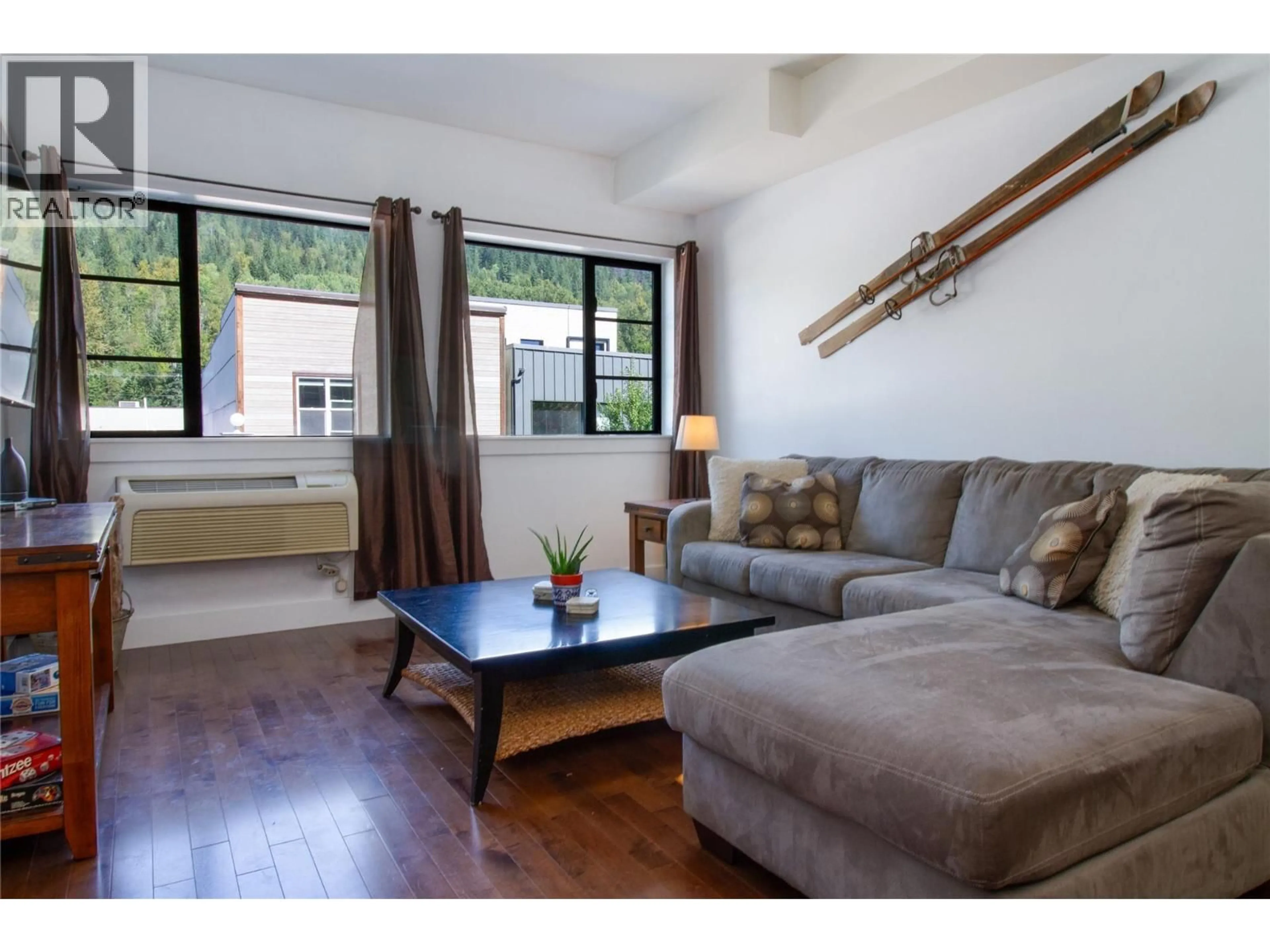 Living room with furniture, wood/laminate floor for 207 - 309 FIRST STREET WEST, Revelstoke British Columbia V0E2S0