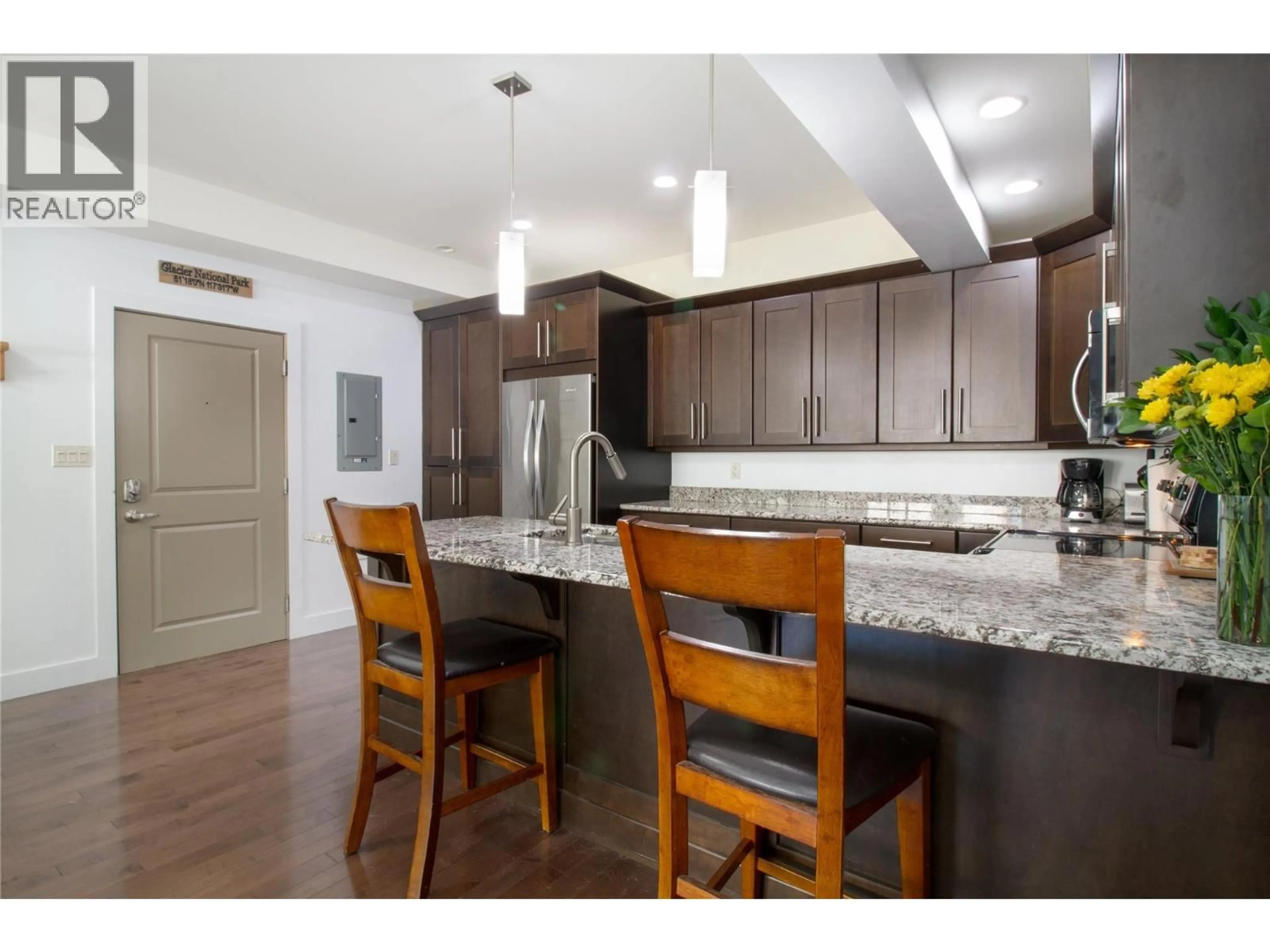 Open concept kitchen, wood/laminate floor for 207 - 309 FIRST STREET WEST, Revelstoke British Columbia V0E2S0