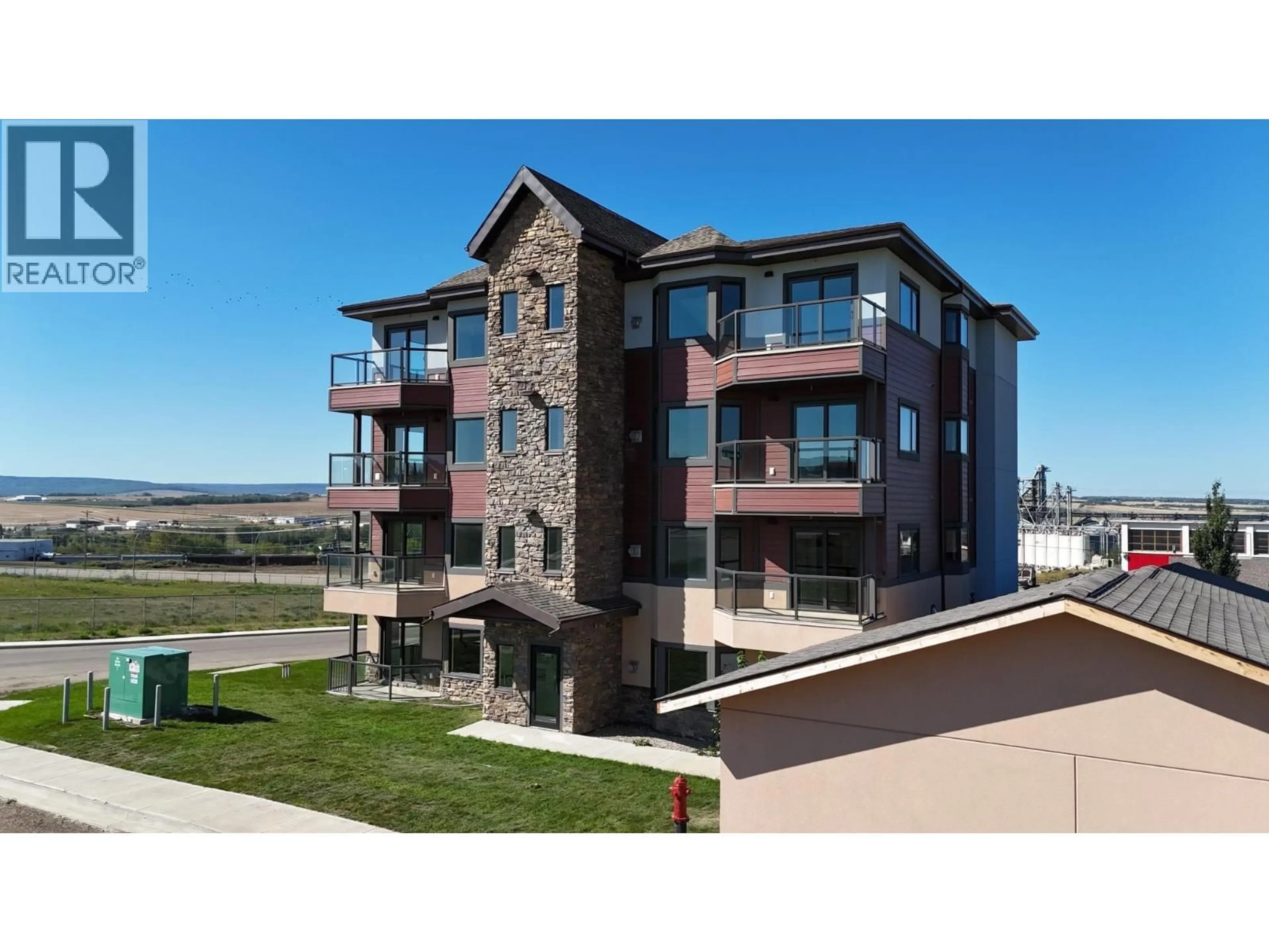 A pic from outside/outdoor area/front of a property/back of a property/a pic from drone, unknown for 1102 - 2032 86 AVENUE, Dawson Creek British Columbia V1G0G7