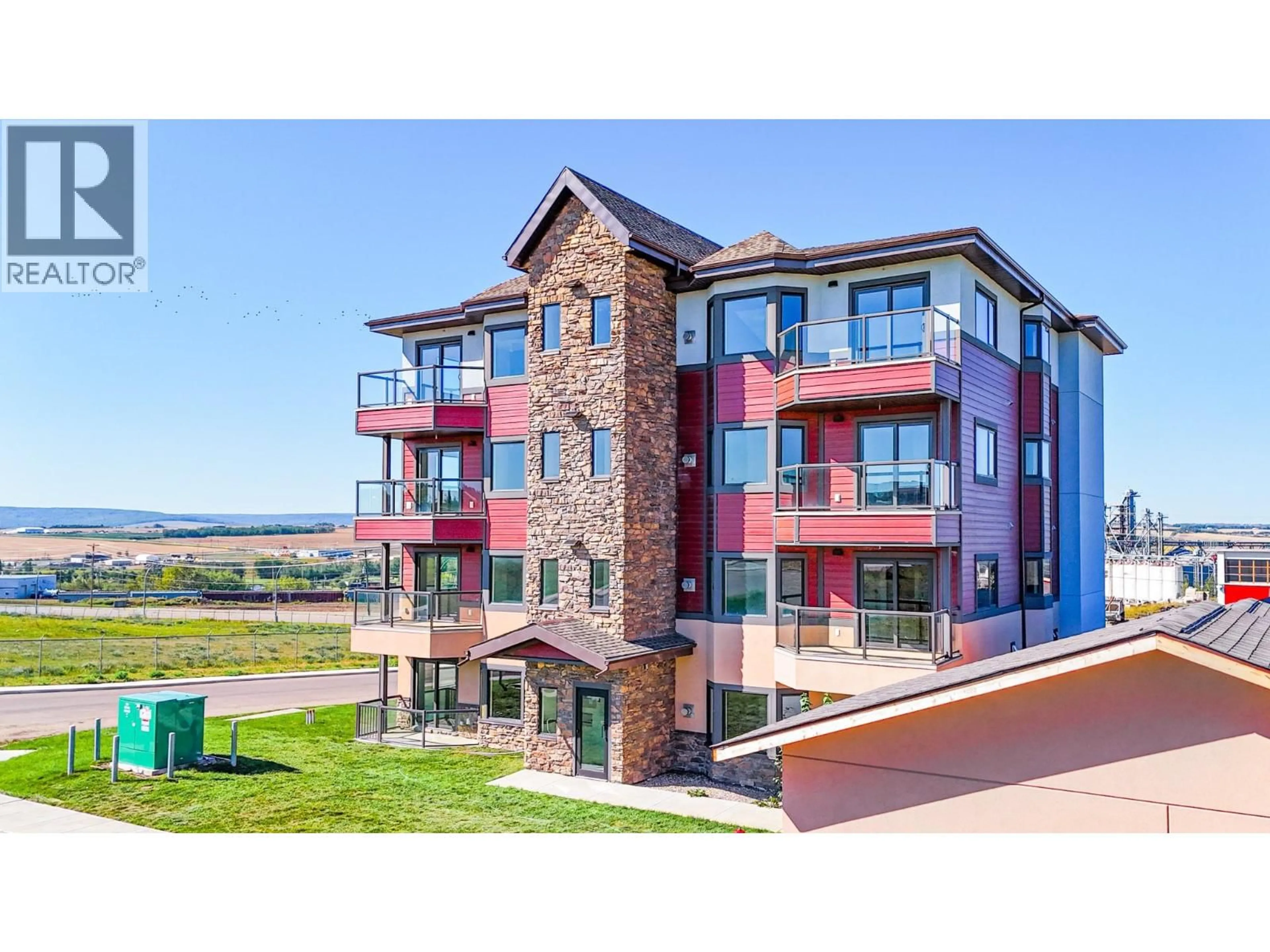 A pic from outside/outdoor area/front of a property/back of a property/a pic from drone, building for 1102 - 2032 86 AVENUE, Dawson Creek British Columbia V1G0G7
