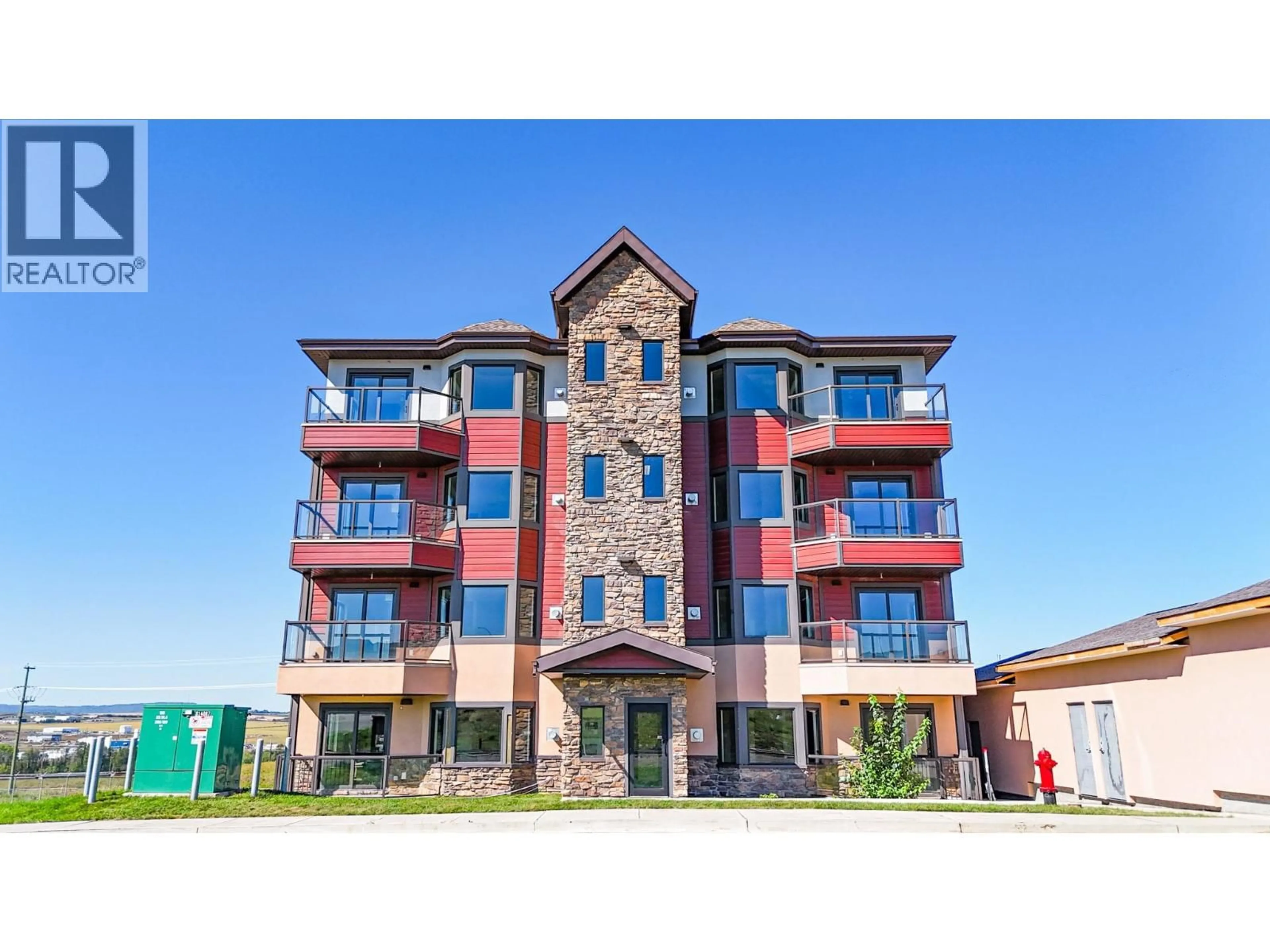 Home with brick exterior material, building for 1301 - 2032 86 AVENUE, Dawson Creek British Columbia V1G0G7
