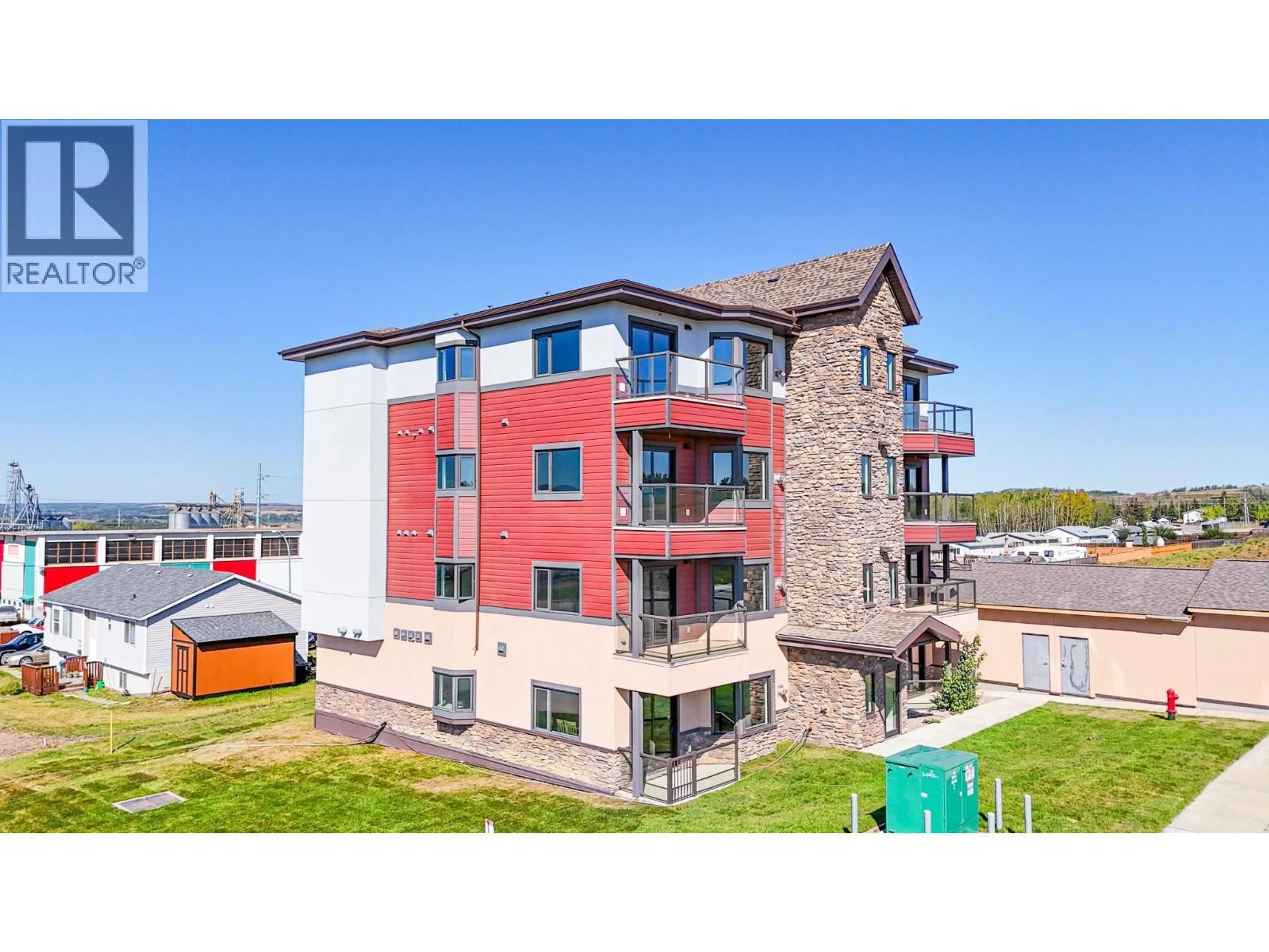 A pic from outside/outdoor area/front of a property/back of a property/a pic from drone, building for 1202 - 2032 86 AVENUE, Dawson Creek British Columbia V1G0G7