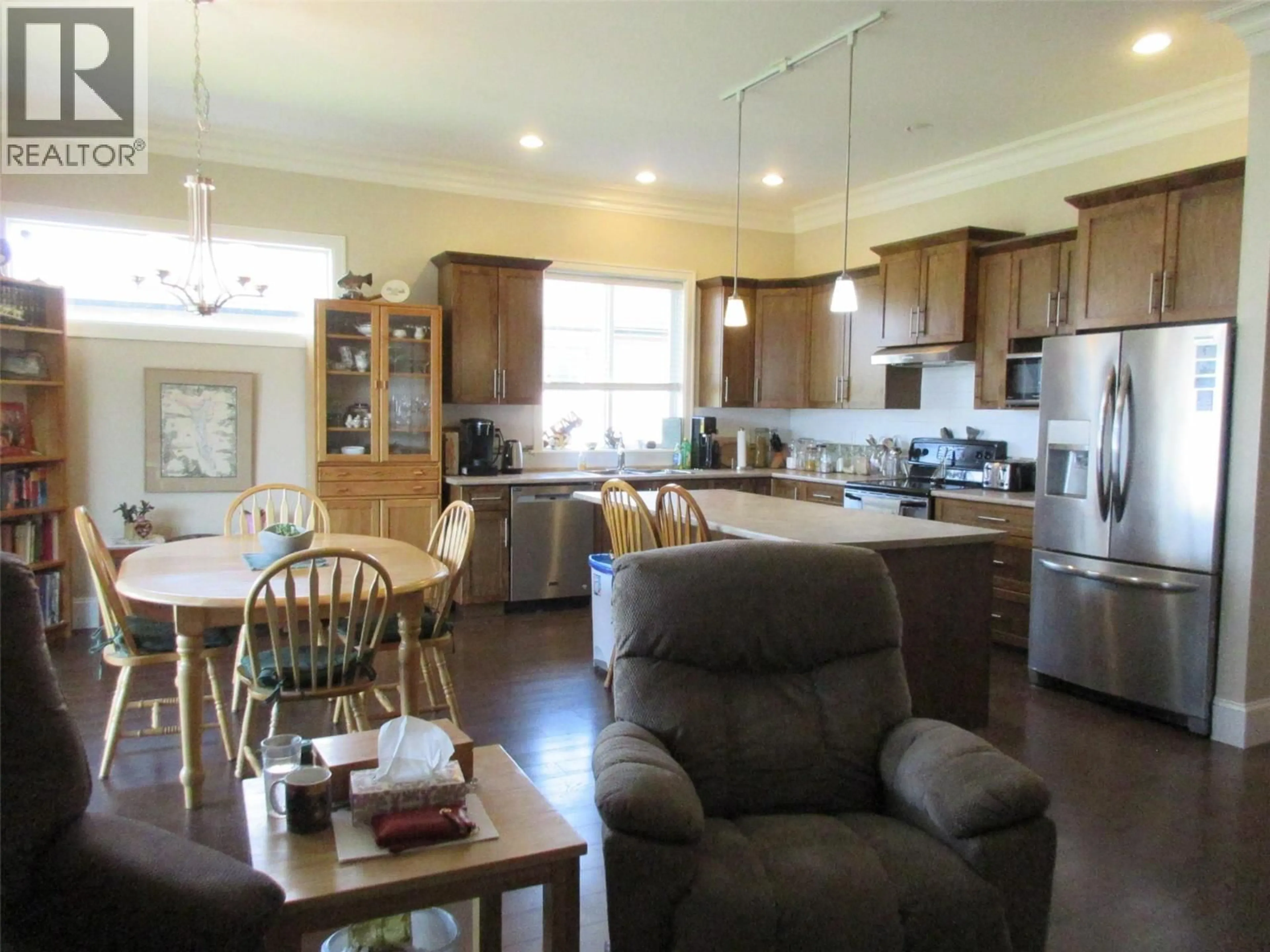 Open concept kitchen, wood/laminate floor for 3027 HILTON DRIVE, Merritt British Columbia V1K0B2
