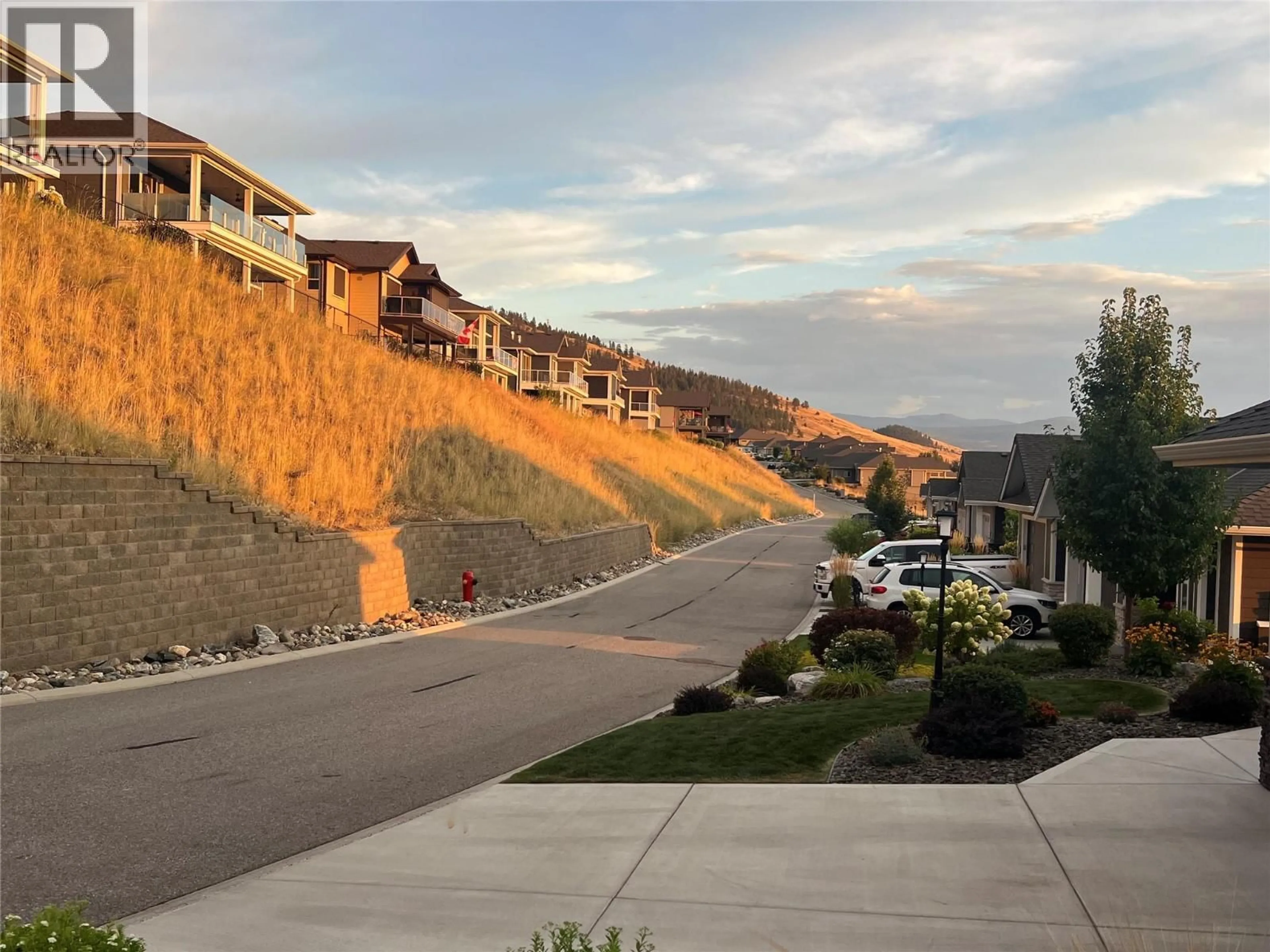 A pic from outside/outdoor area/front of a property/back of a property/a pic from drone, mountain view for 3938 CIMARRON DRIVE, Kelowna British Columbia V1X8E4