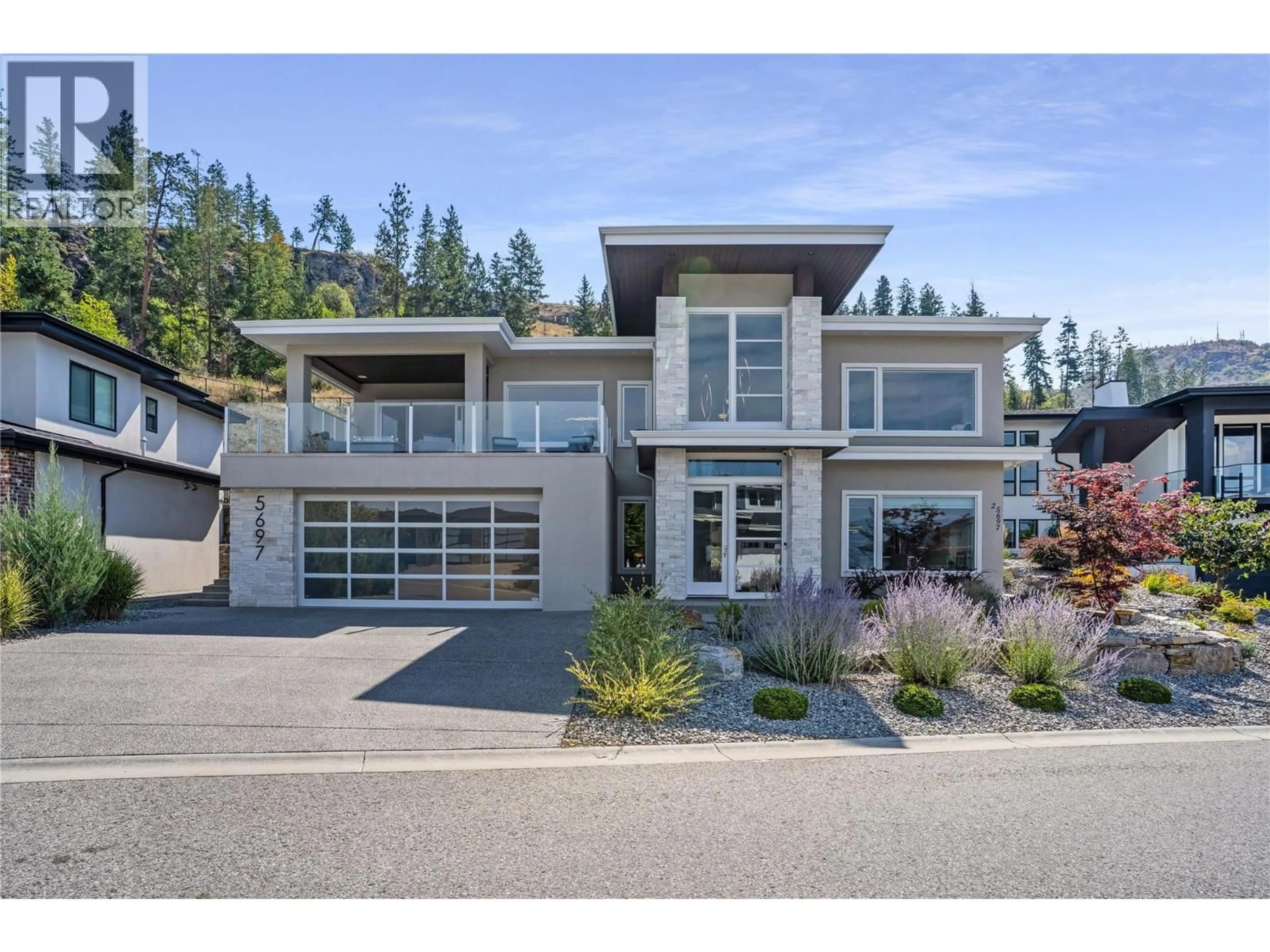 Home with vinyl exterior material, street for 5697 JASPER WAY, Kelowna British Columbia V1W5L7