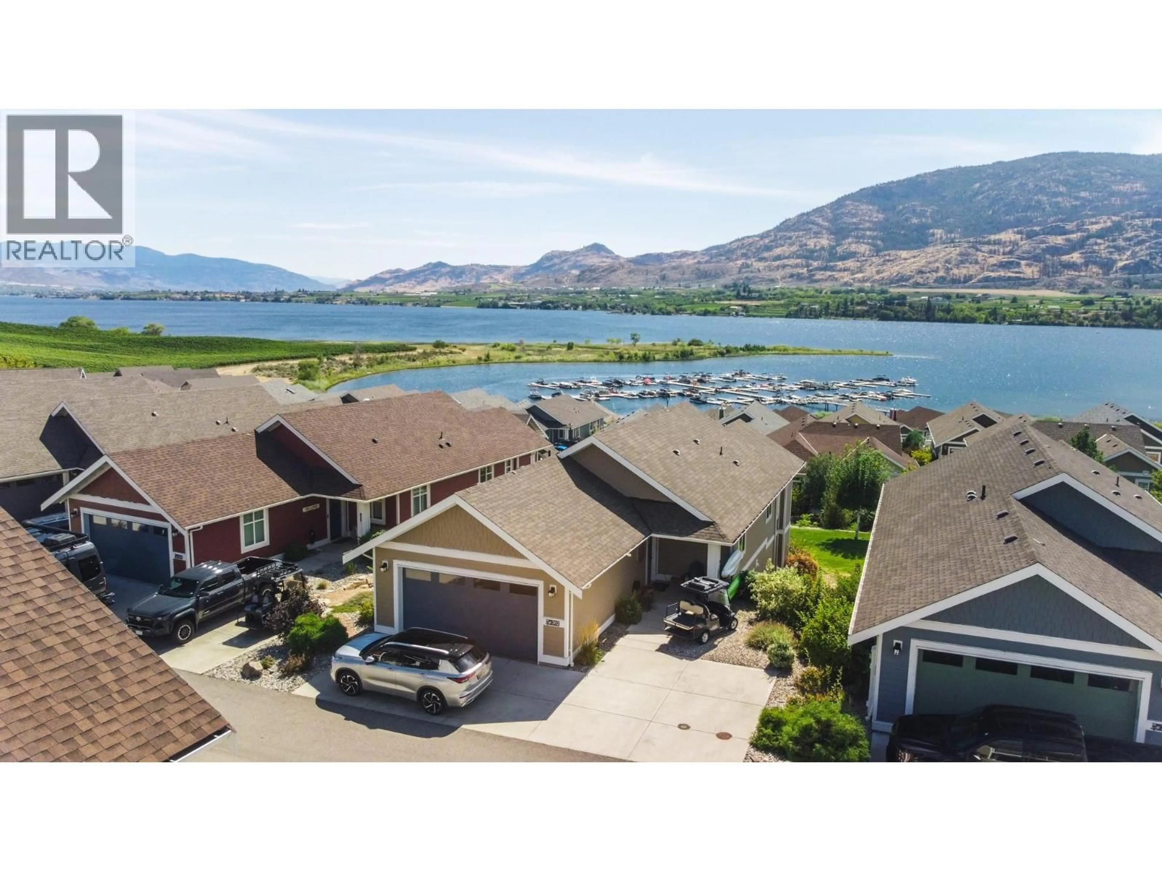 A pic from outside/outdoor area/front of a property/back of a property/a pic from drone, water/lake/river/ocean view for 202 - 2450 RADIO TOWER ROAD, Oliver British Columbia V0H1T1