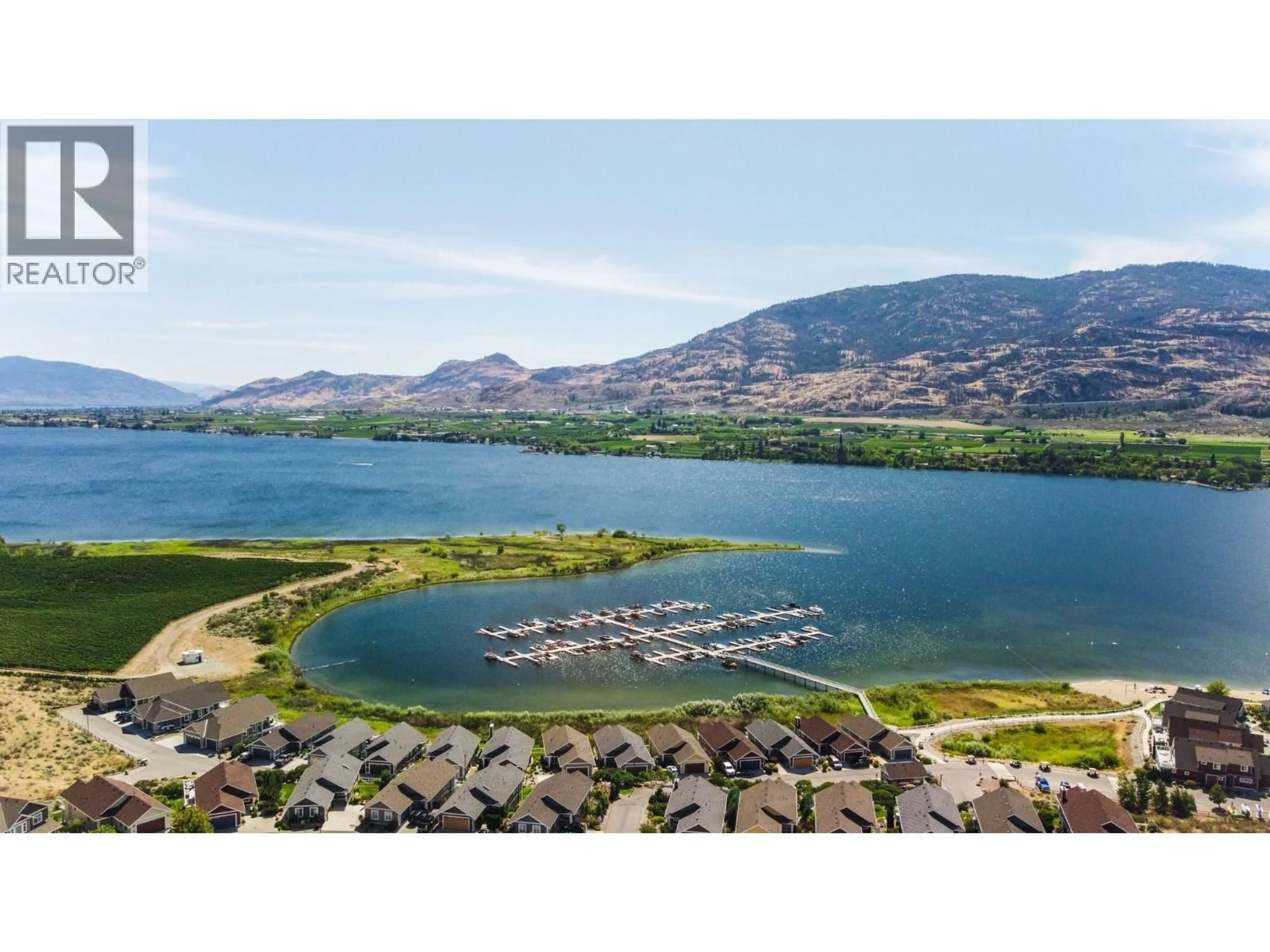 A pic from outside/outdoor area/front of a property/back of a property/a pic from drone, water/lake/river/ocean view for 202 - 2450 RADIO TOWER ROAD, Oliver British Columbia V0H1T1