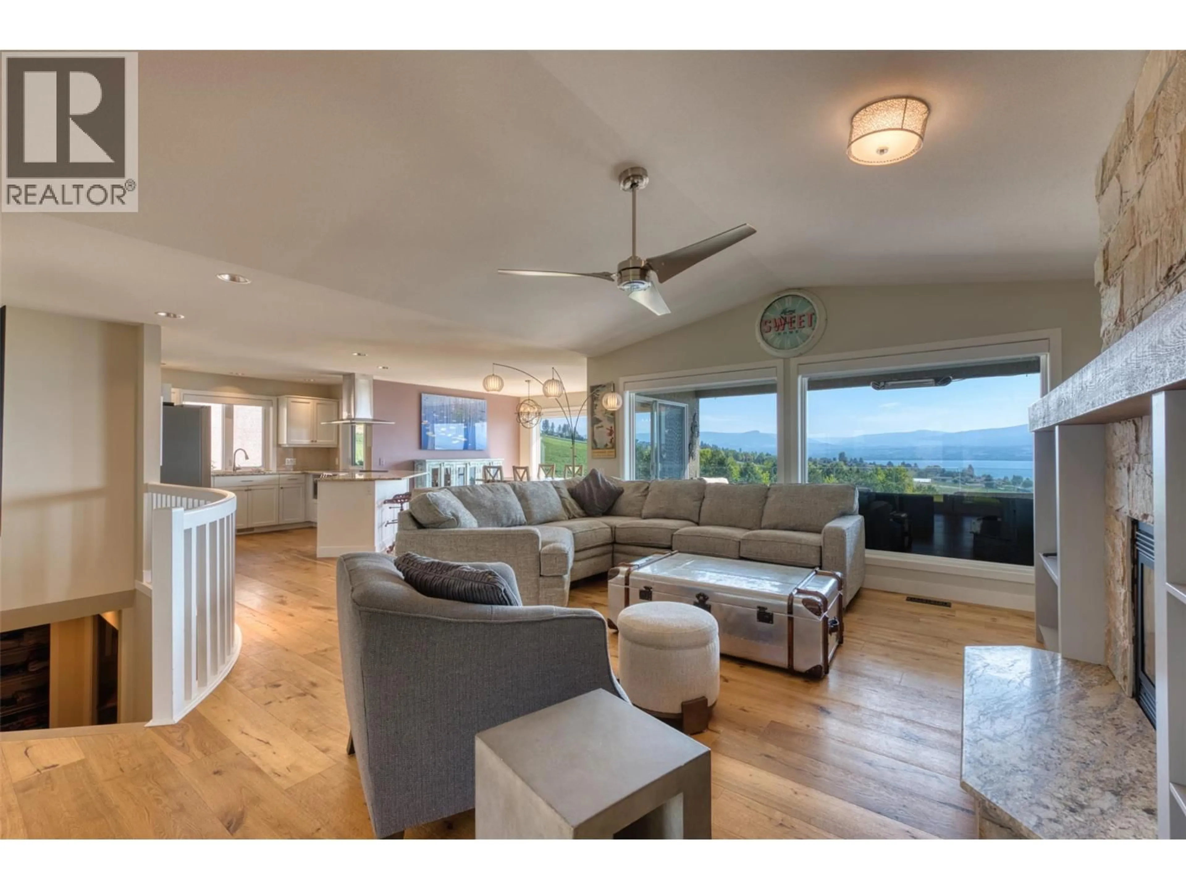 Living room with furniture, wood/laminate floor for 6 - 3333 CHANCELLOR PLACE, West Kelowna British Columbia V4T2S9