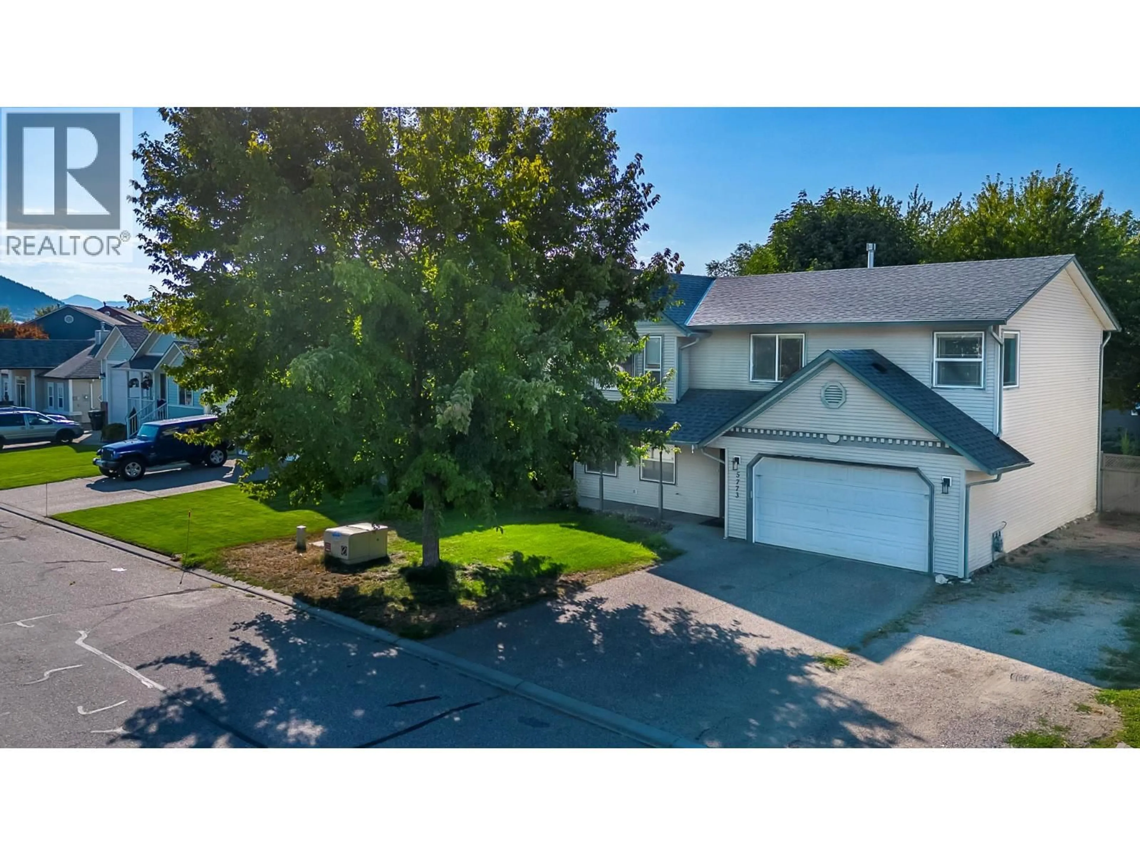 A pic from outside/outdoor area/front of a property/back of a property/a pic from drone, street for 5773 TERN PLACE, Vernon British Columbia V1H1R2
