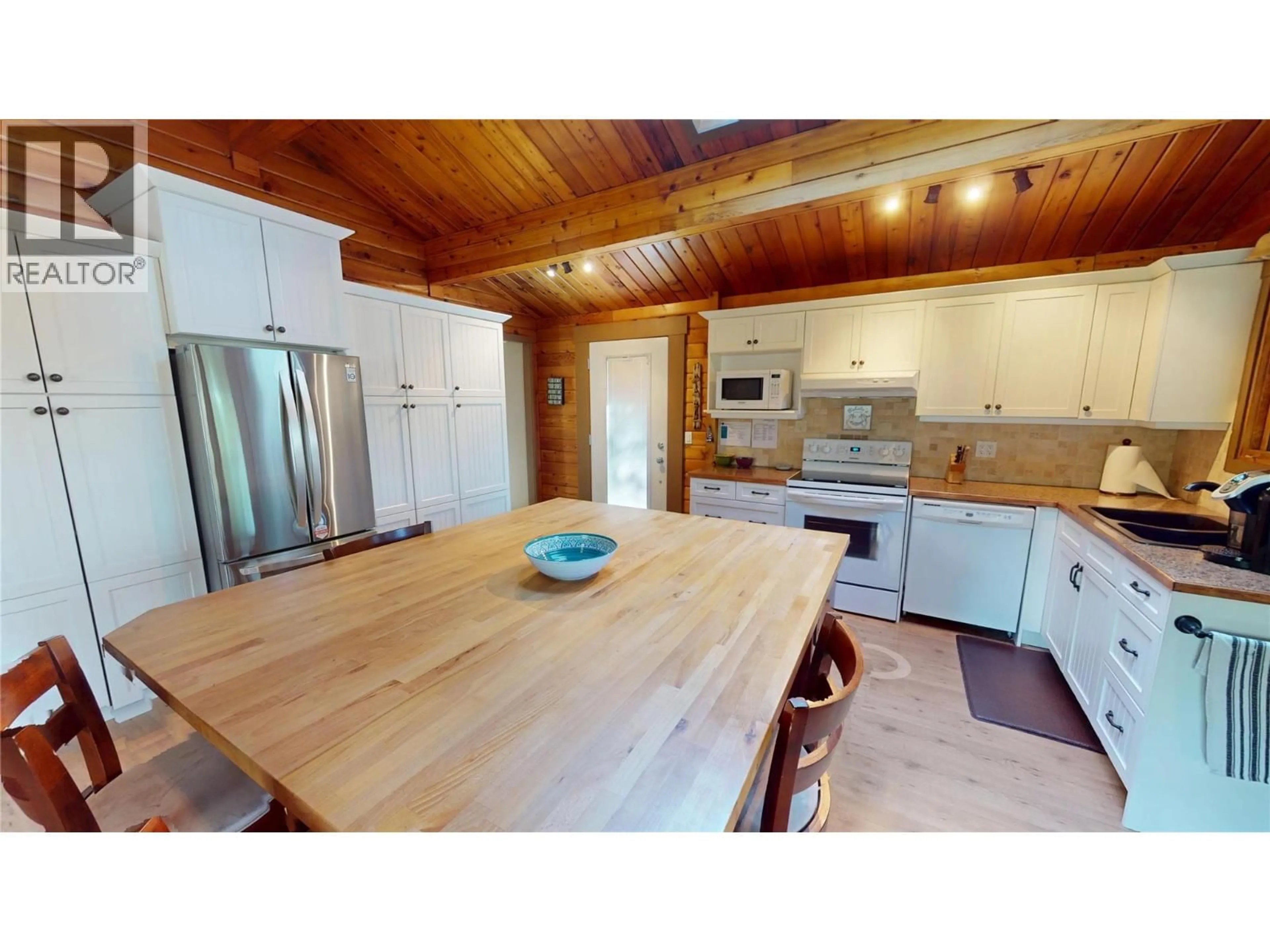 Open concept kitchen, wood/laminate floor for 110 INDIAN BEACH ROAD, Windermere British Columbia V0B2L2