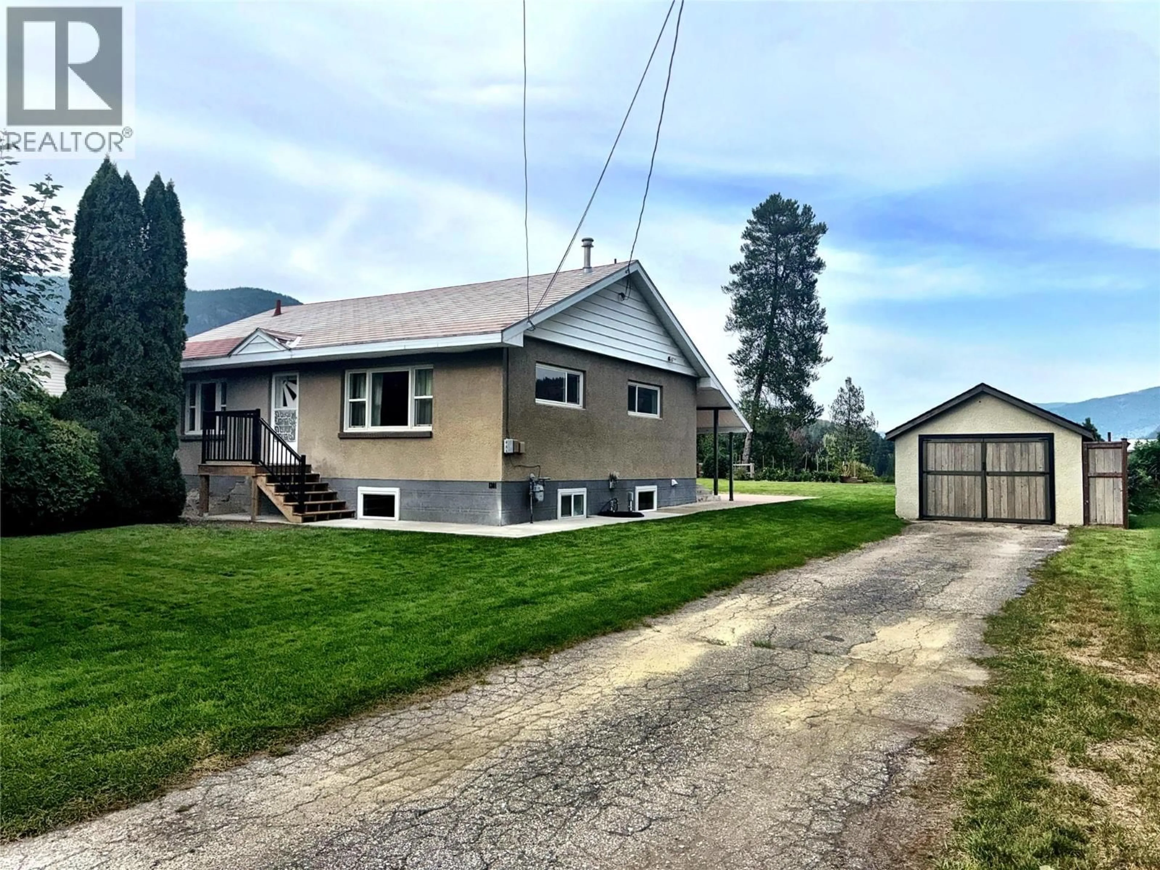 A pic from outside/outdoor area/front of a property/back of a property/a pic from drone, street for 1301 6TH STREET, Genelle British Columbia V0G1G0