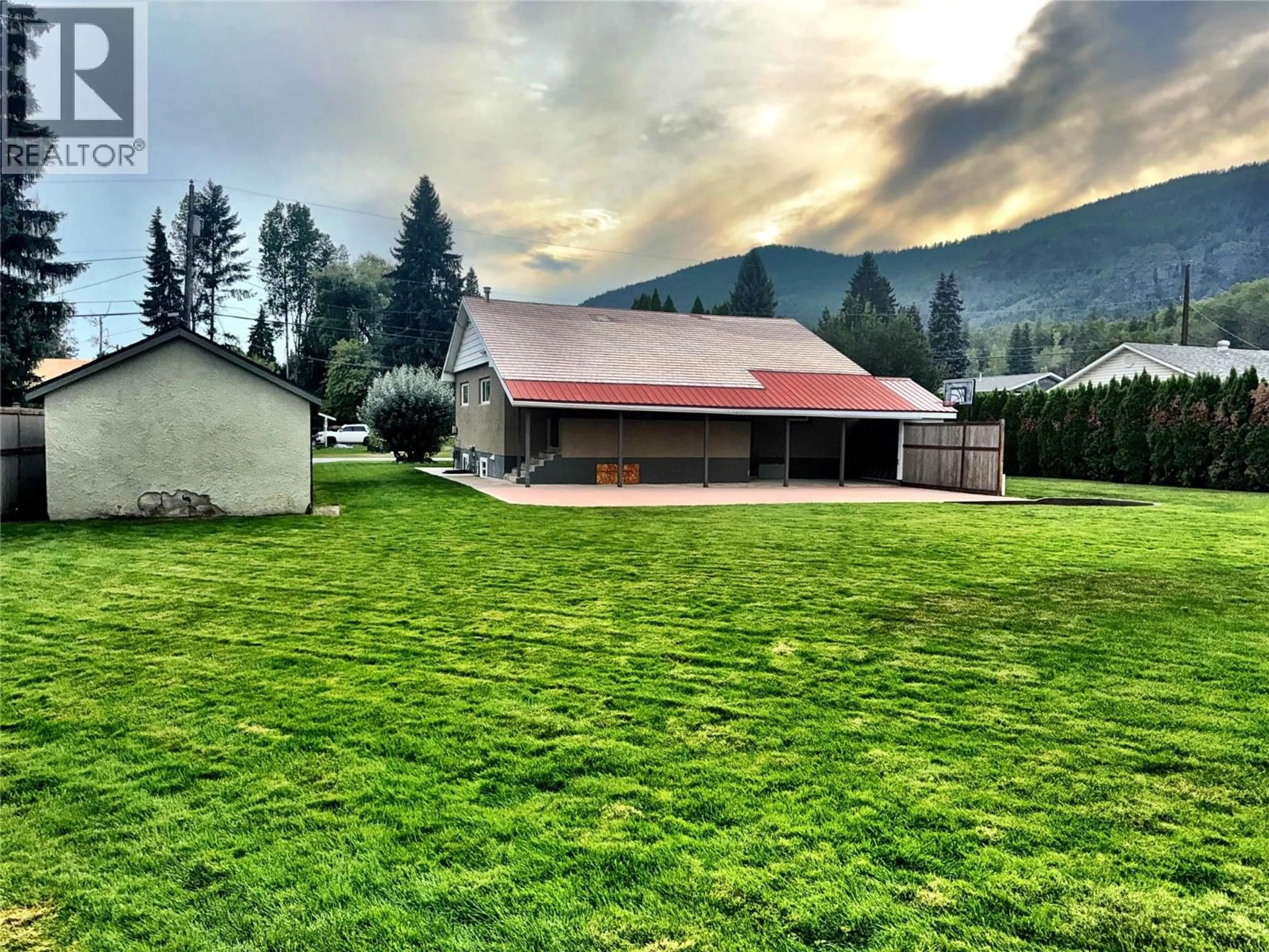 A pic from outside/outdoor area/front of a property/back of a property/a pic from drone, mountain view for 1301 6TH STREET, Genelle British Columbia V0G1G0