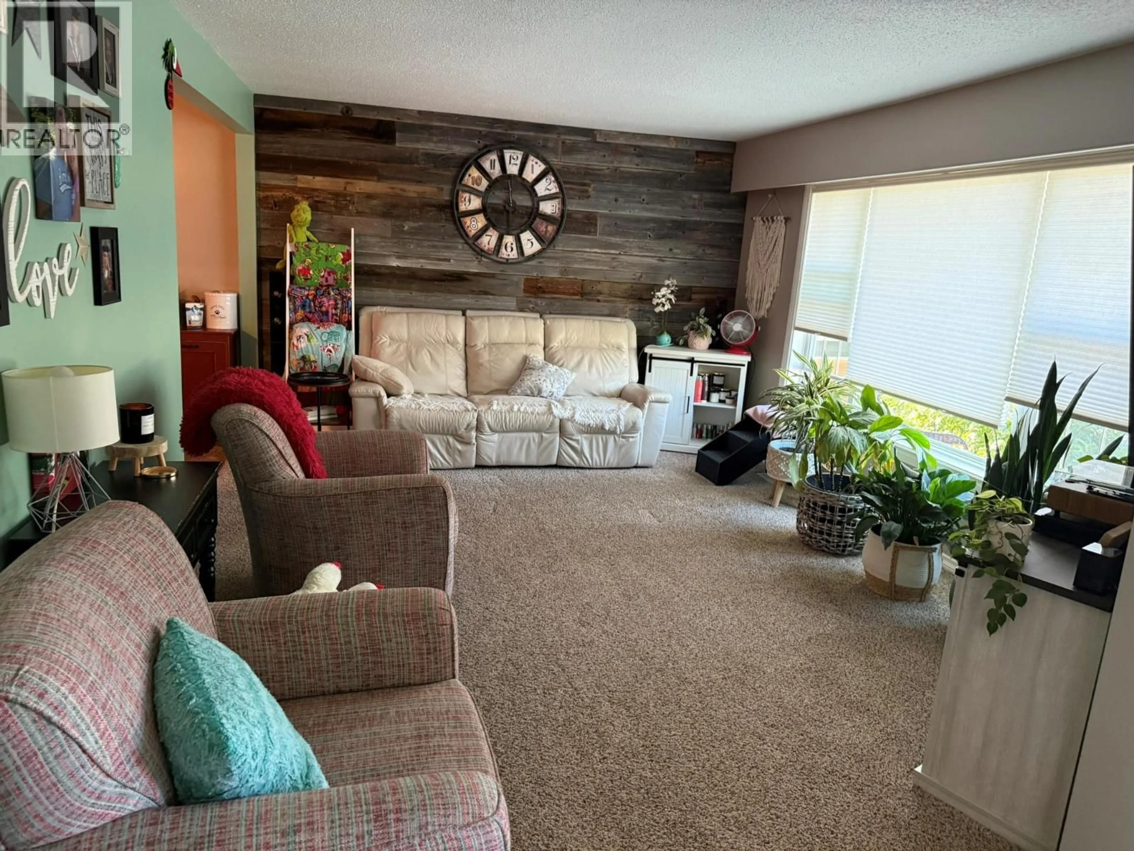 Living room with furniture, wood/laminate floor for 1633 94 AVENUE, Dawson Creek British Columbia V1G1H3