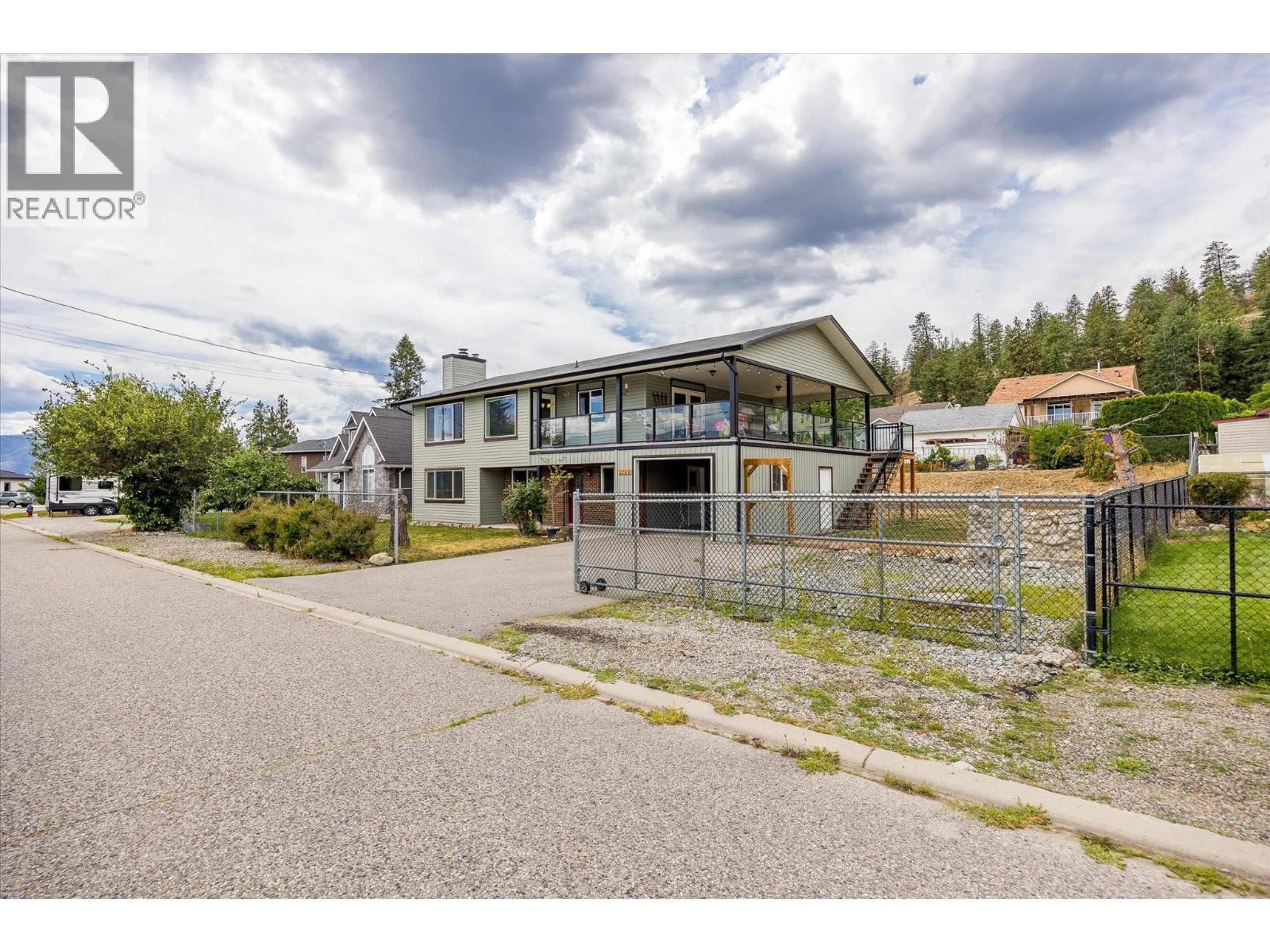 A pic from outside/outdoor area/front of a property/back of a property/a pic from drone, mountain view for 5749 MACKENZIE ROAD, Peachland British Columbia V0H1X4