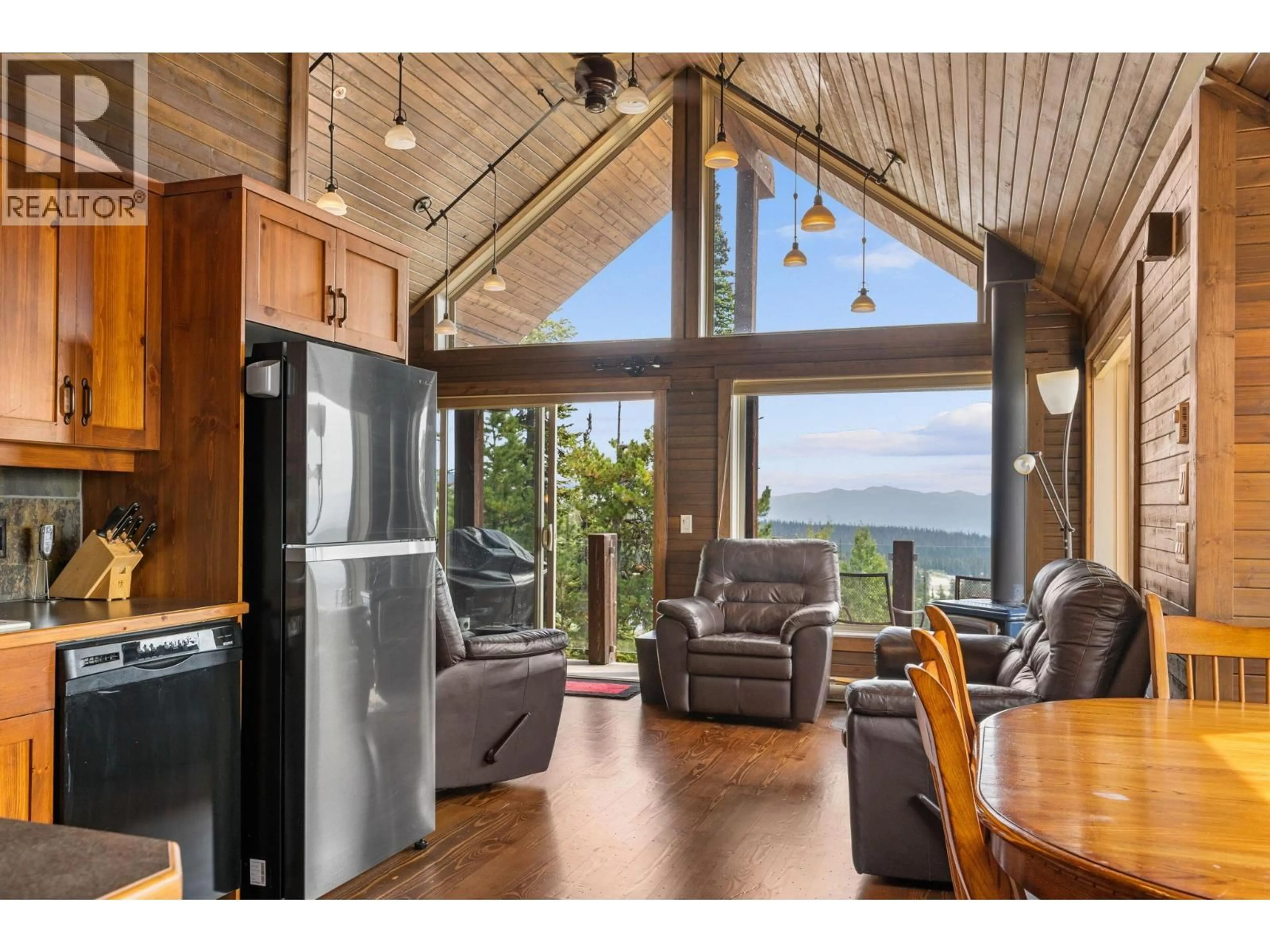 Open concept kitchen, wood/laminate floor for 5890 SNOW PINES CRESCENT, Big White British Columbia V1P1P3
