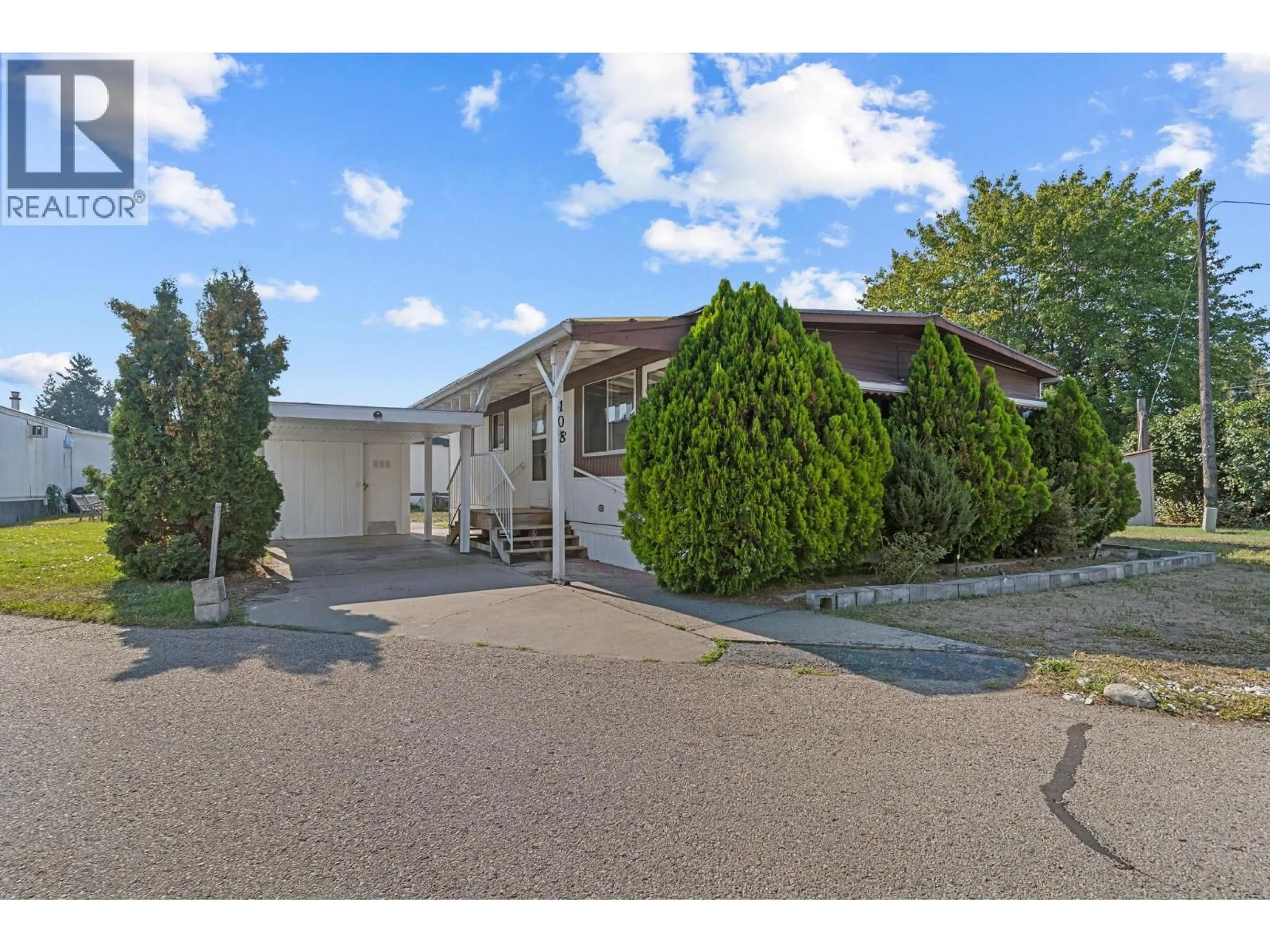 A pic from outside/outdoor area/front of a property/back of a property/a pic from drone, street for 108 - 1133 FINDLAY ROAD, Kelowna British Columbia V1X5A9
