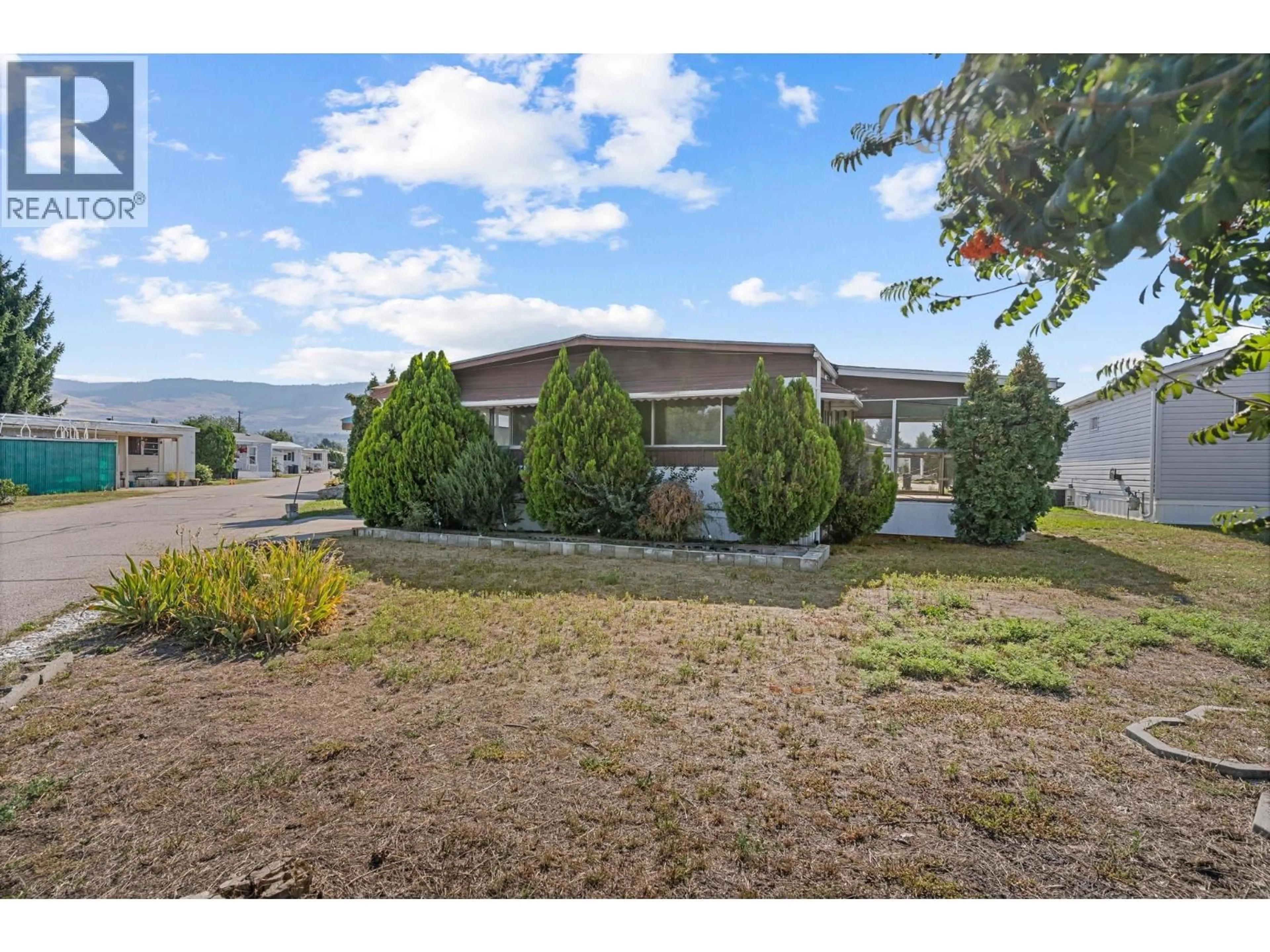 A pic from outside/outdoor area/front of a property/back of a property/a pic from drone, mountain view for 108 - 1133 FINDLAY ROAD, Kelowna British Columbia V1X5A9