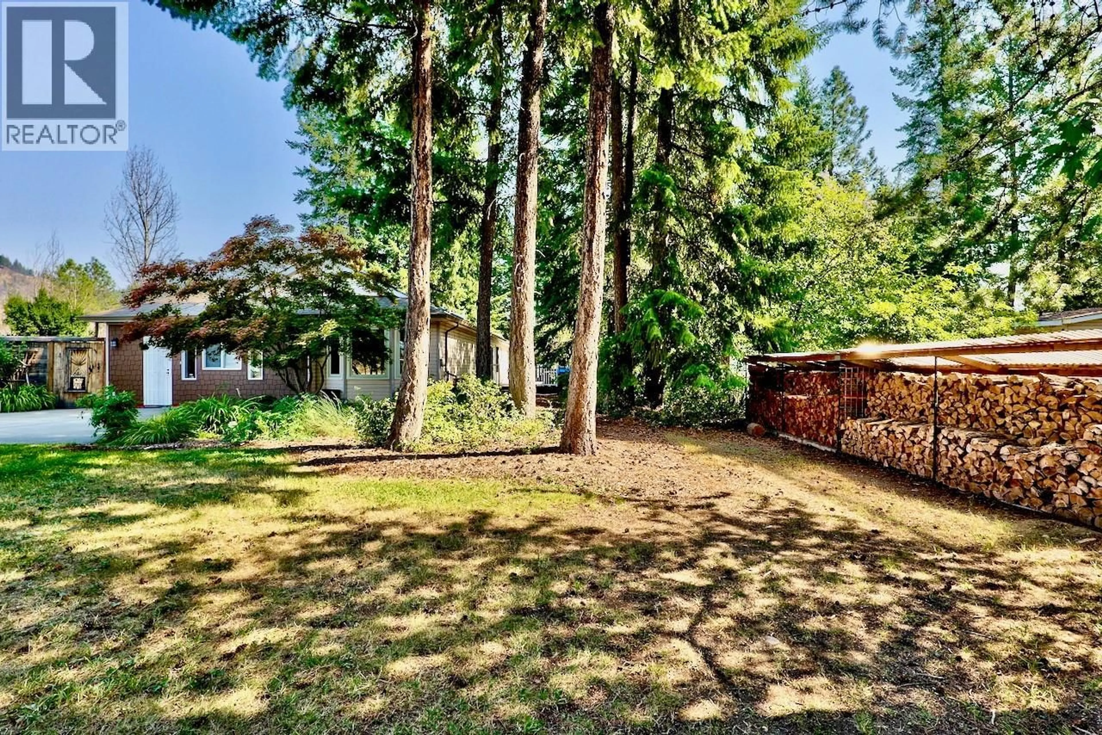 A pic from outside/outdoor area/front of a property/back of a property/a pic from drone, forest/trees view for 1260 SCOTCH CREEK WHARF ROAD, Scotch Creek British Columbia V0E1M5
