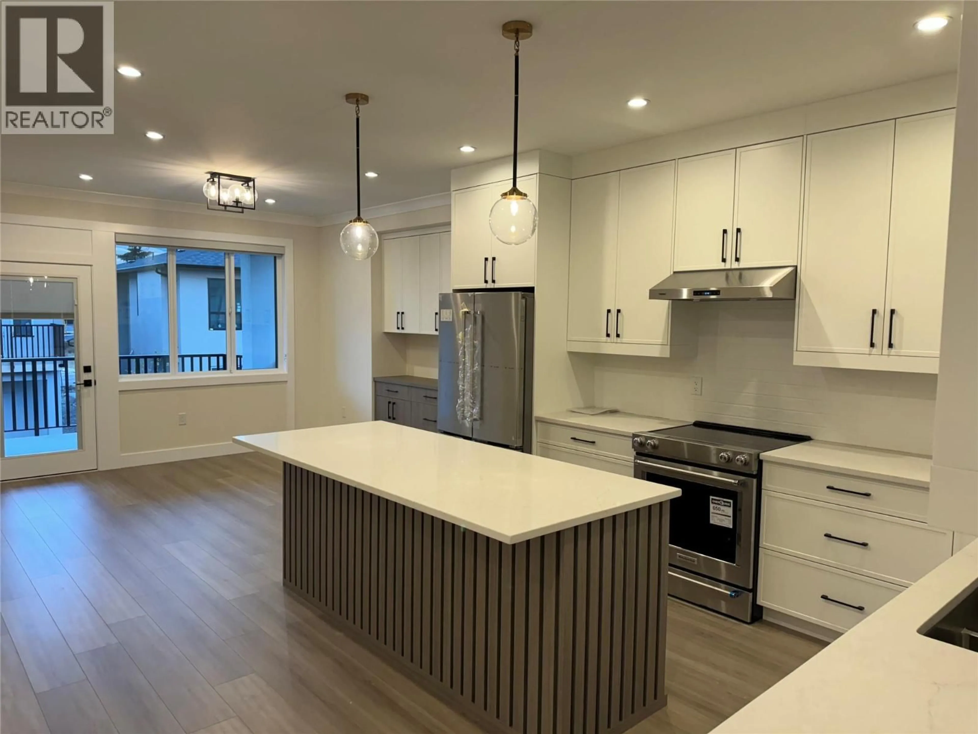Open concept kitchen, wood/laminate floor for 25 - 19950 MCCARTHY ROAD, Lake Country British Columbia V4V1T1
