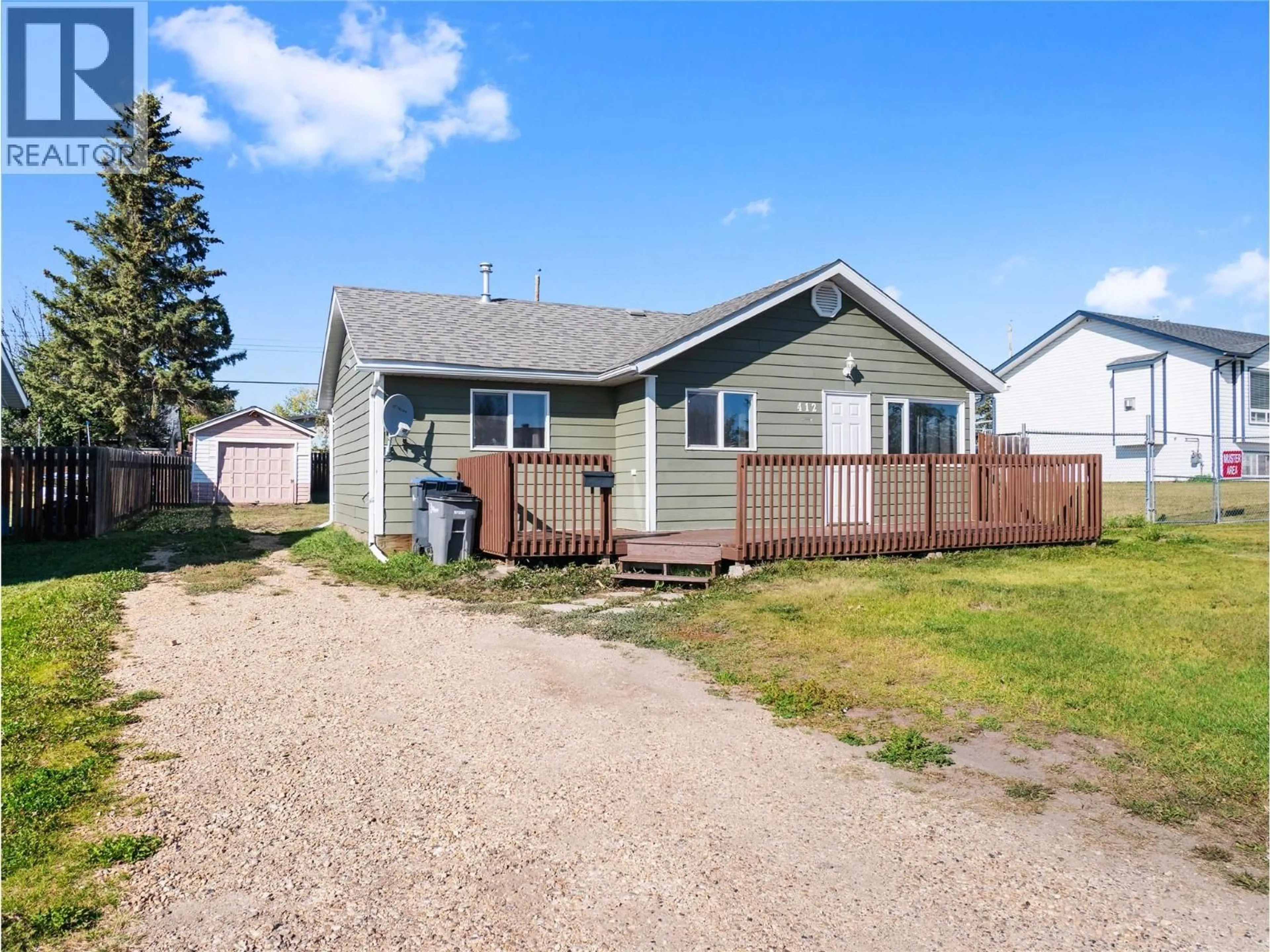 Home with vinyl exterior material, street for 412 100 AVENUE, Dawson Creek British Columbia V1G1V7