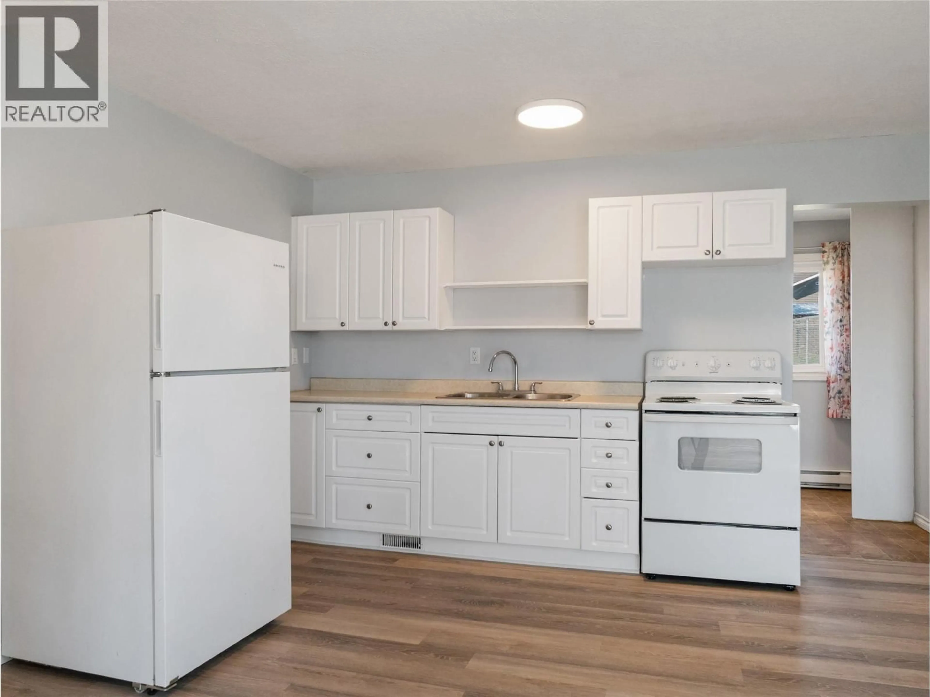 Standard kitchen, wood/laminate floor for 412 100 AVENUE, Dawson Creek British Columbia V1G1V7