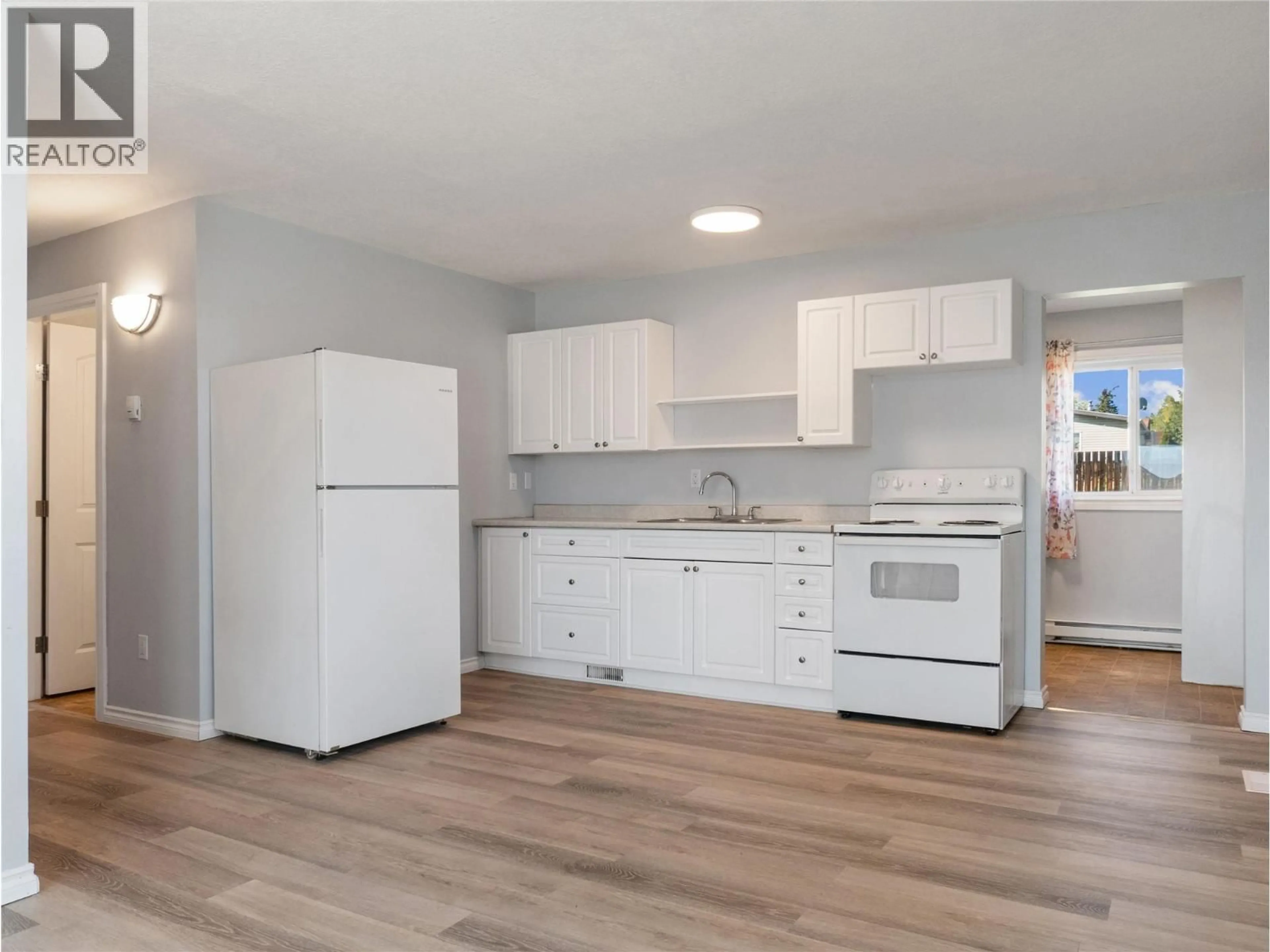Standard kitchen, wood/laminate floor for 412 100 AVENUE, Dawson Creek British Columbia V1G1V7