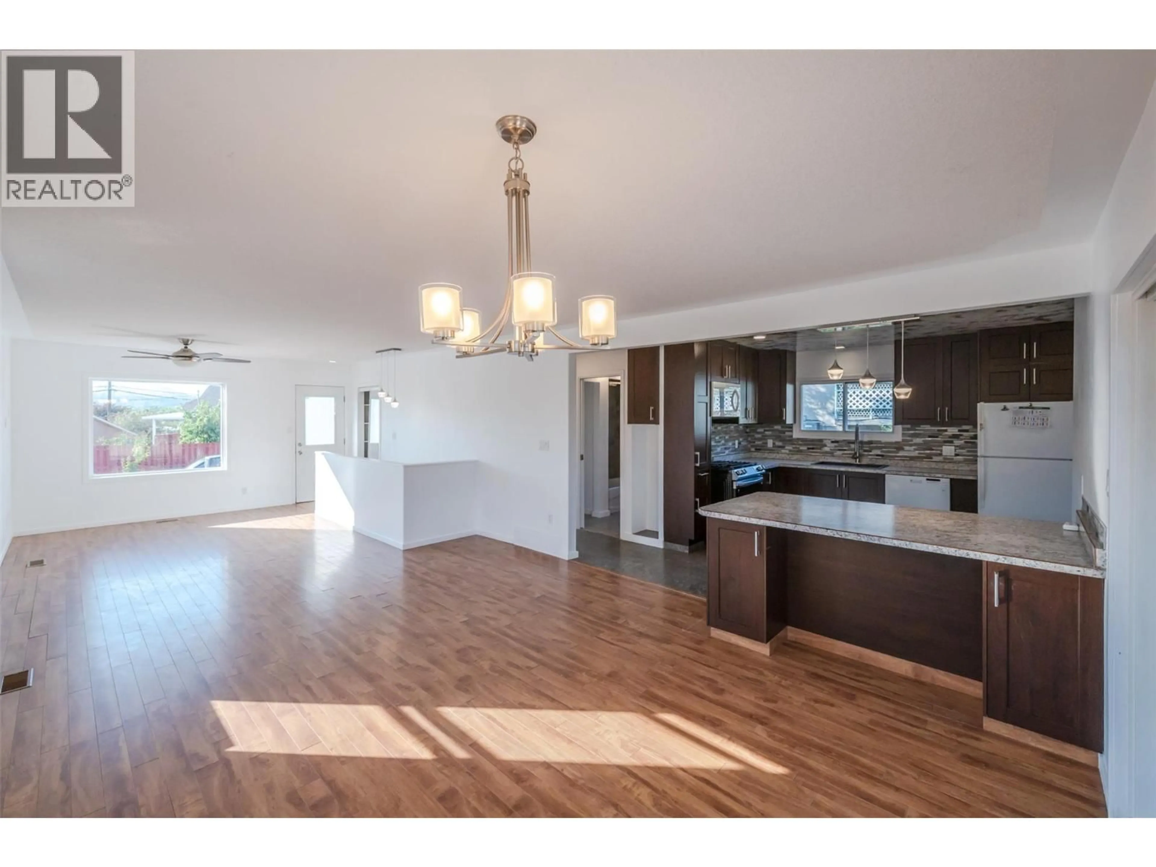 Open concept kitchen, wood/laminate floor for 6556 KOOTENAY STREET, Oliver British Columbia V0H1T0