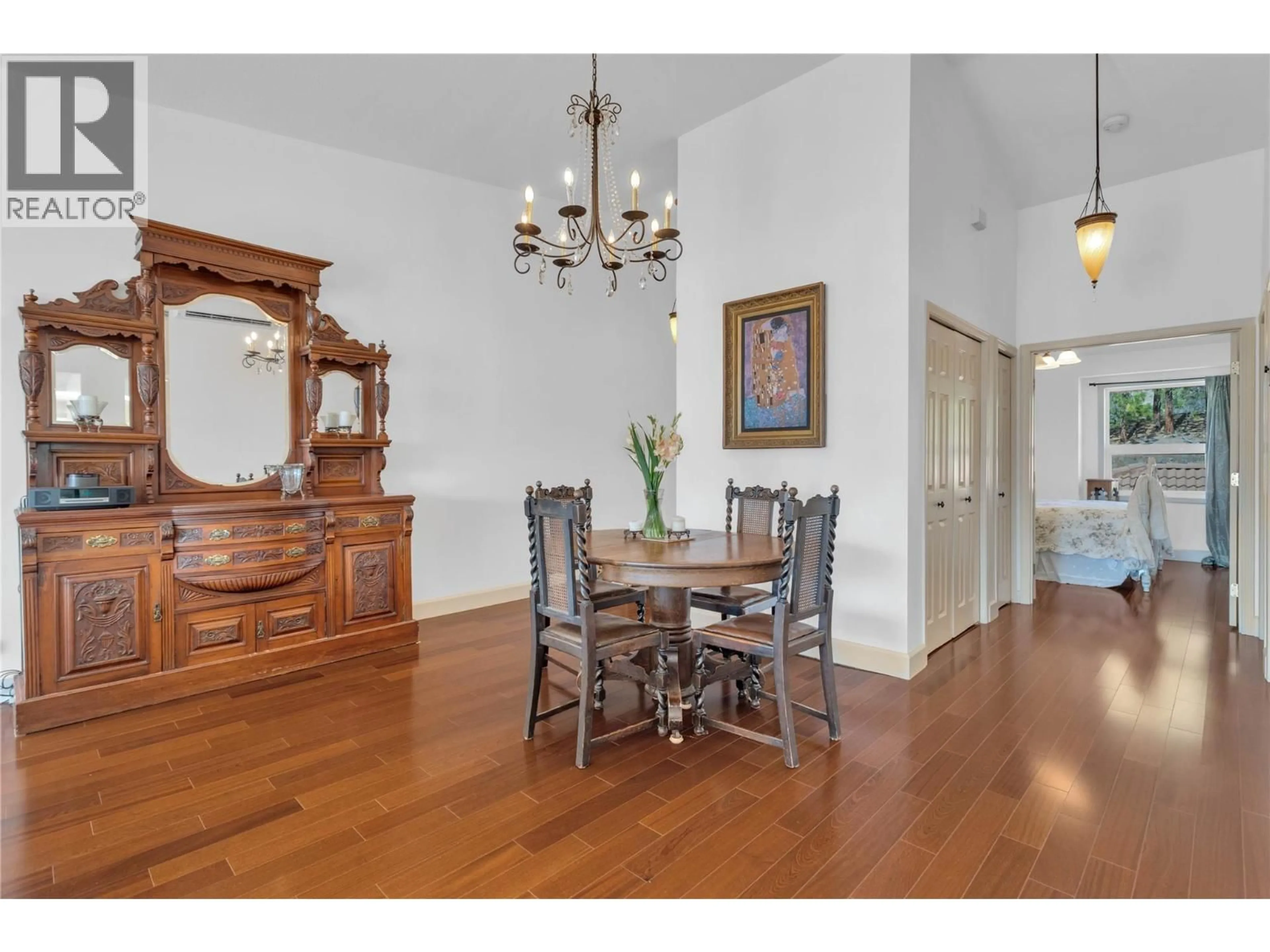 Dining room, wood/laminate floor for 203 - 4450 PONDEROSA DRIVE, Peachland British Columbia V0H1X5