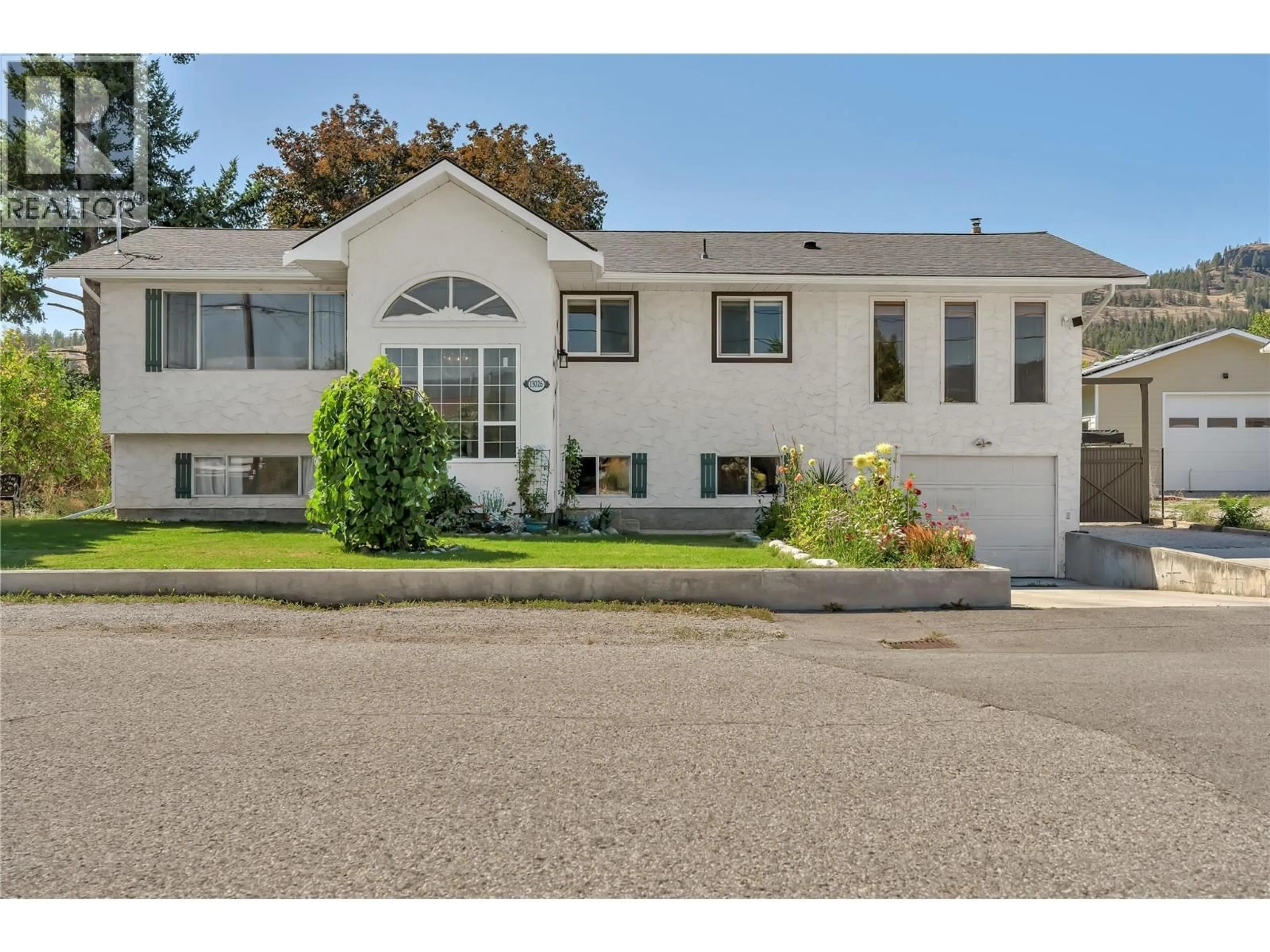 Home with vinyl exterior material, street for 13026 STEVEN AVENUE, Summerland British Columbia V0H1Z0