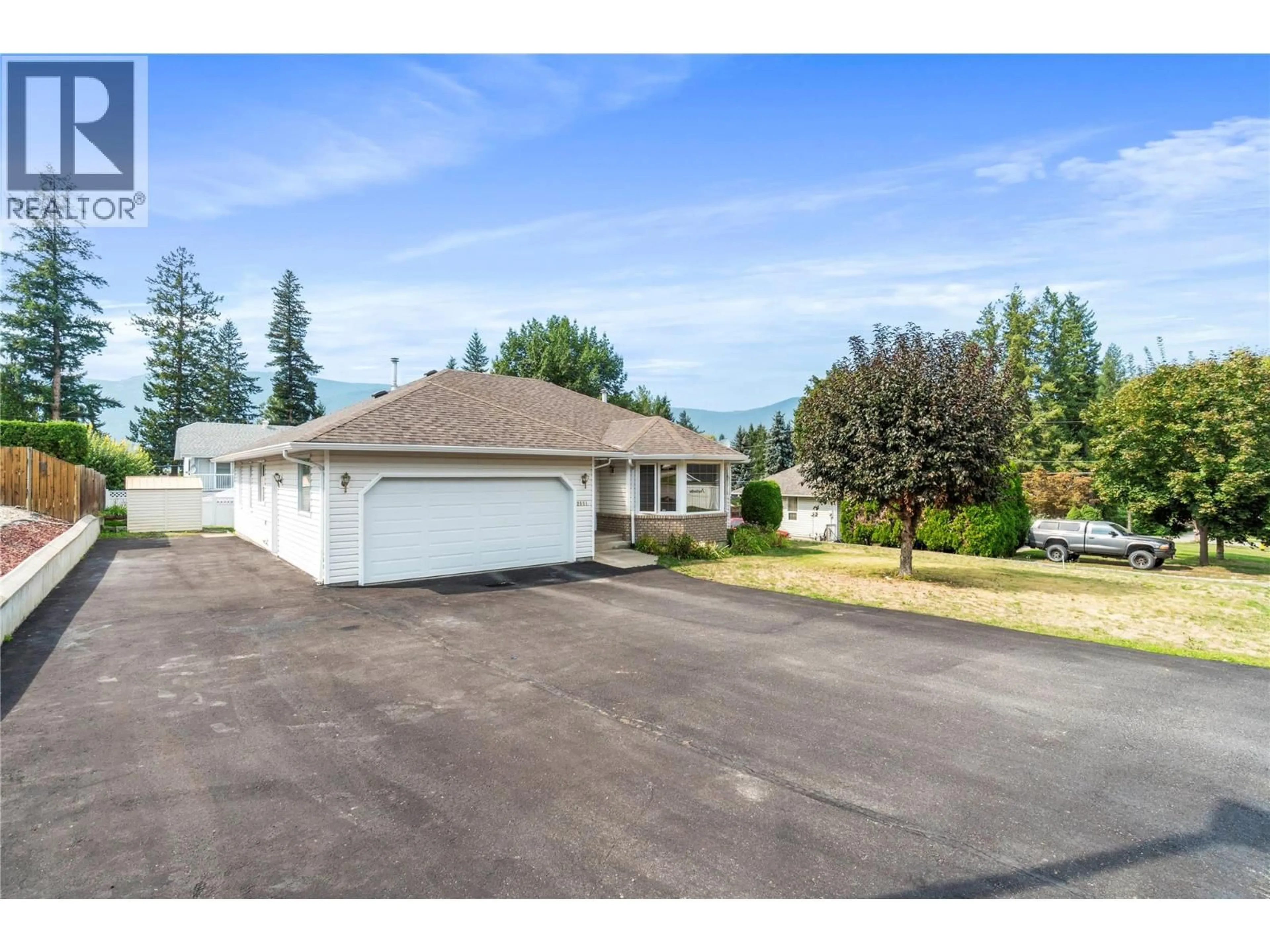 A pic from outside/outdoor area/front of a property/back of a property/a pic from drone, street for 2081 13TH STREET SOUTHWEST, Salmon Arm British Columbia V1E1L6