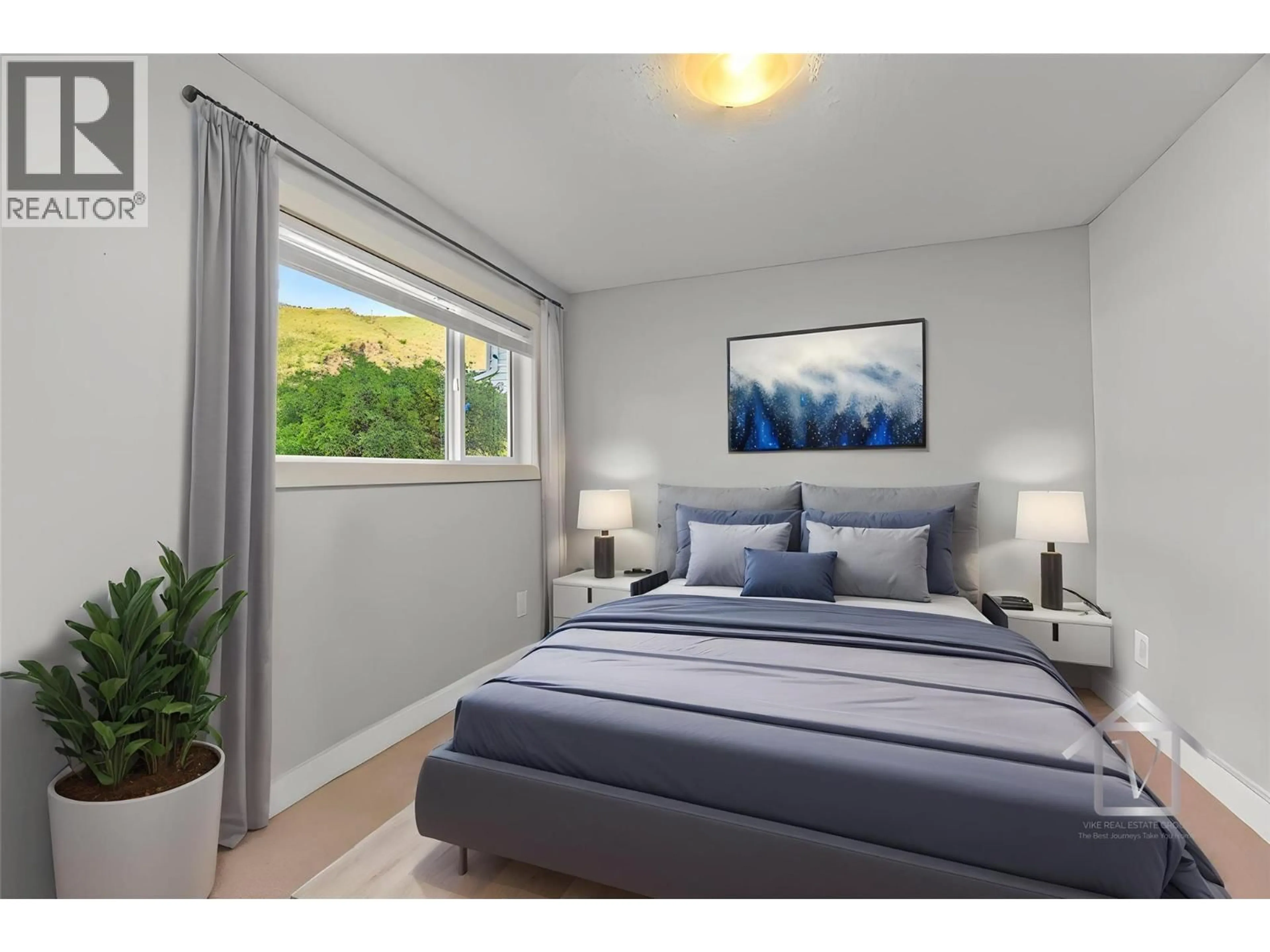 Bedroom with bed, wood/laminate floor for 4061 DAVIE ROAD, Kamloops British Columbia V2H1K8