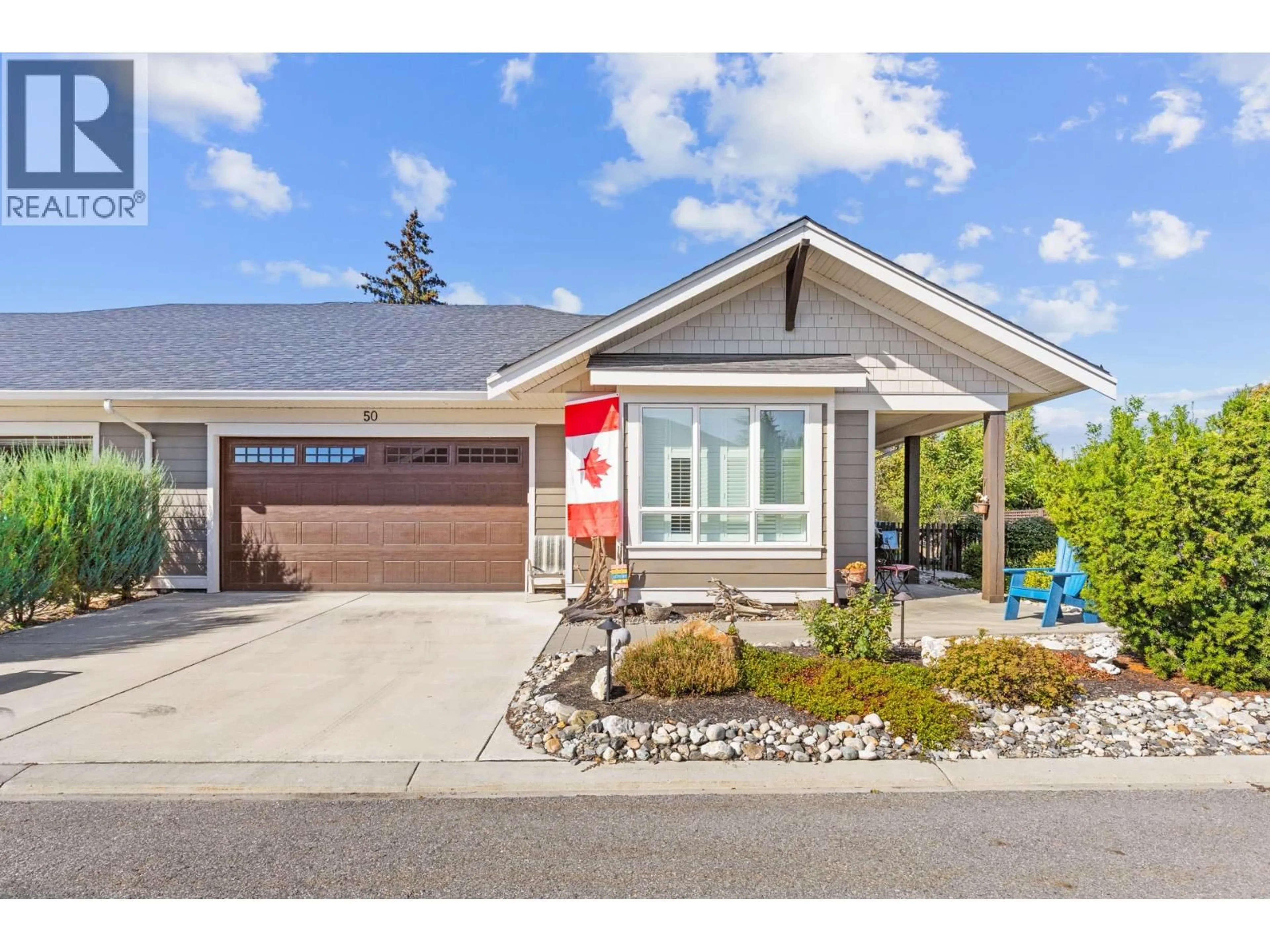 Home with vinyl exterior material, street for 50 - 1960 KLO ROAD, Kelowna British Columbia V1W5L2