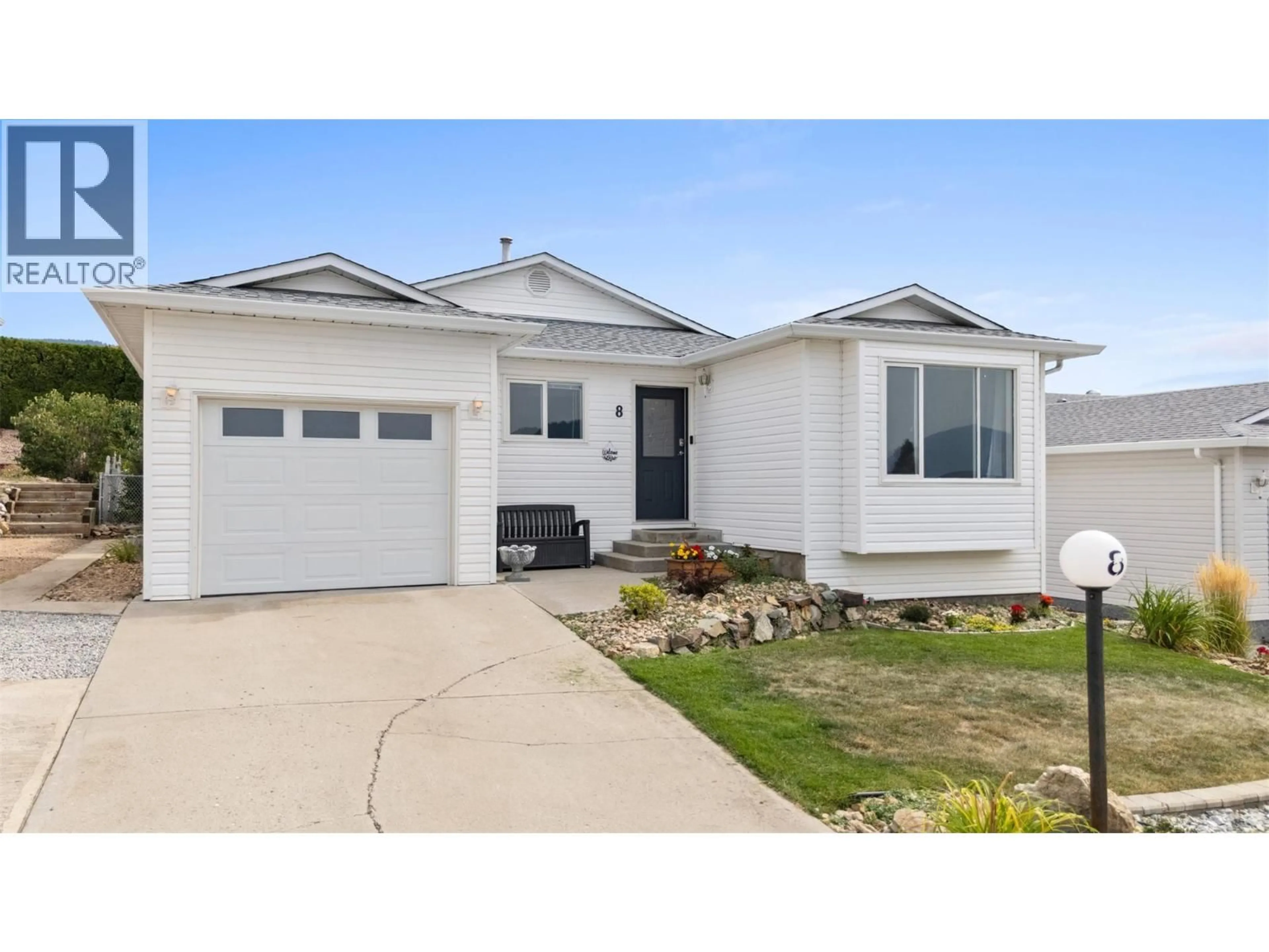 Home with vinyl exterior material, street for 8 - 6400 SPENCER ROAD, Kelowna British Columbia V1X7T6
